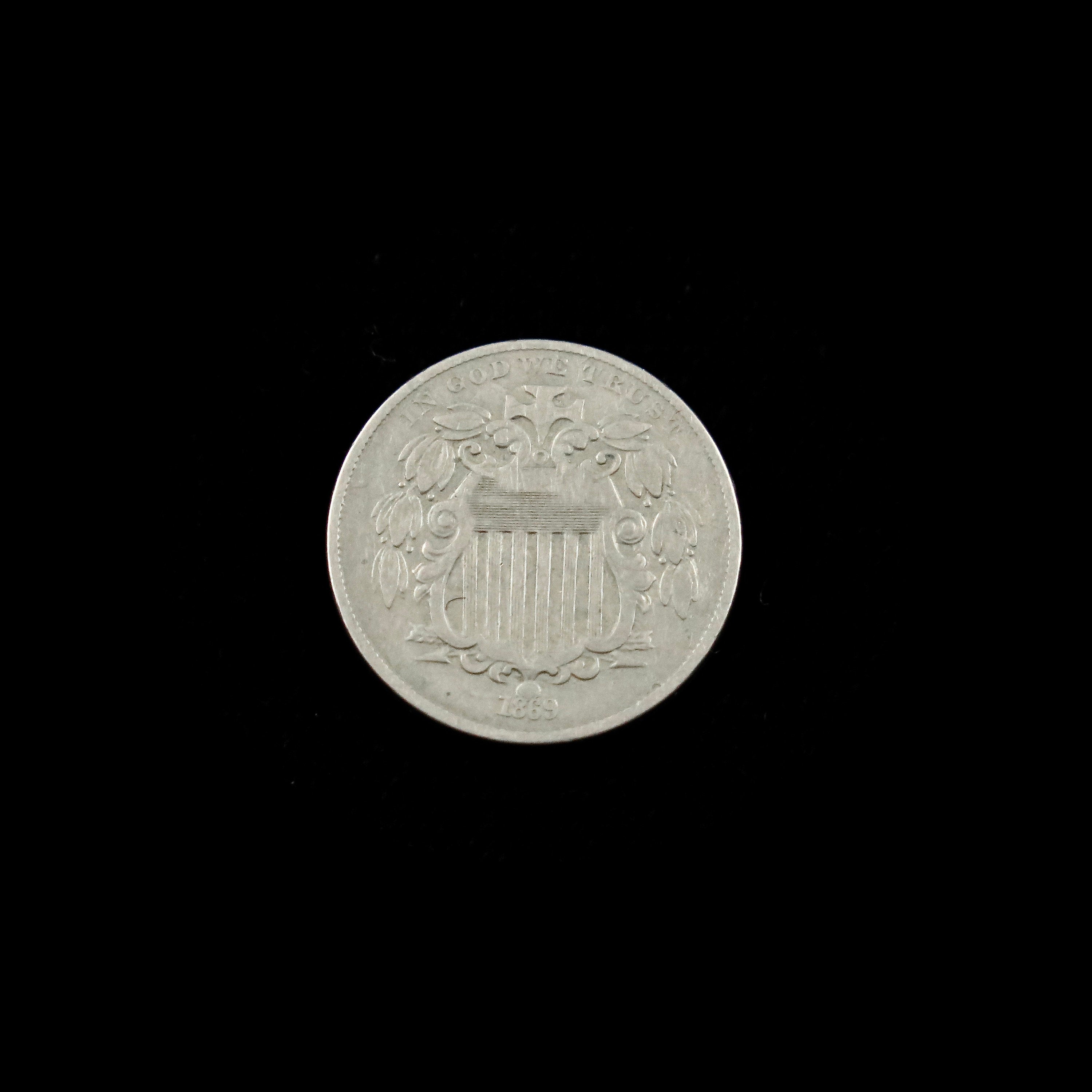 1869 Shield Nickel with narrow date, EF grade, raw U.S. five-cent coin from Black Market LLC featuring detailed shield design.