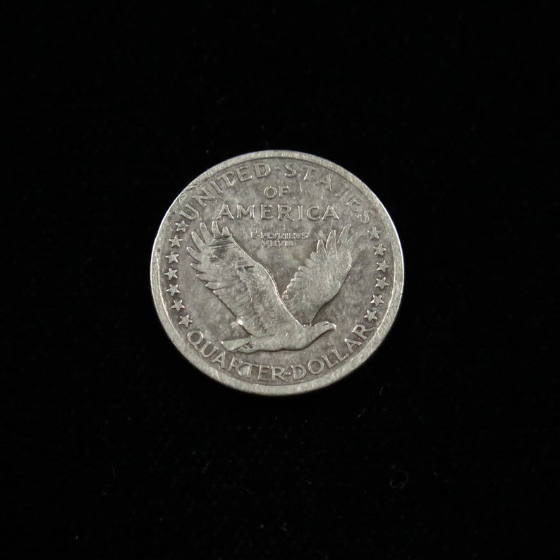 1917 Standing Liberty Quarter Type 1 fine condition U.S. silver coin, raw, featuring Lady Liberty on the obverse and eagle on the reverse.