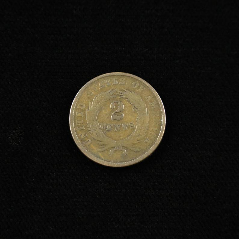 1865 Civil War-era U.S. Two Cent Piece by Black Market LLC, Fancy 5, Fine, raw condition with detailed coin surface.