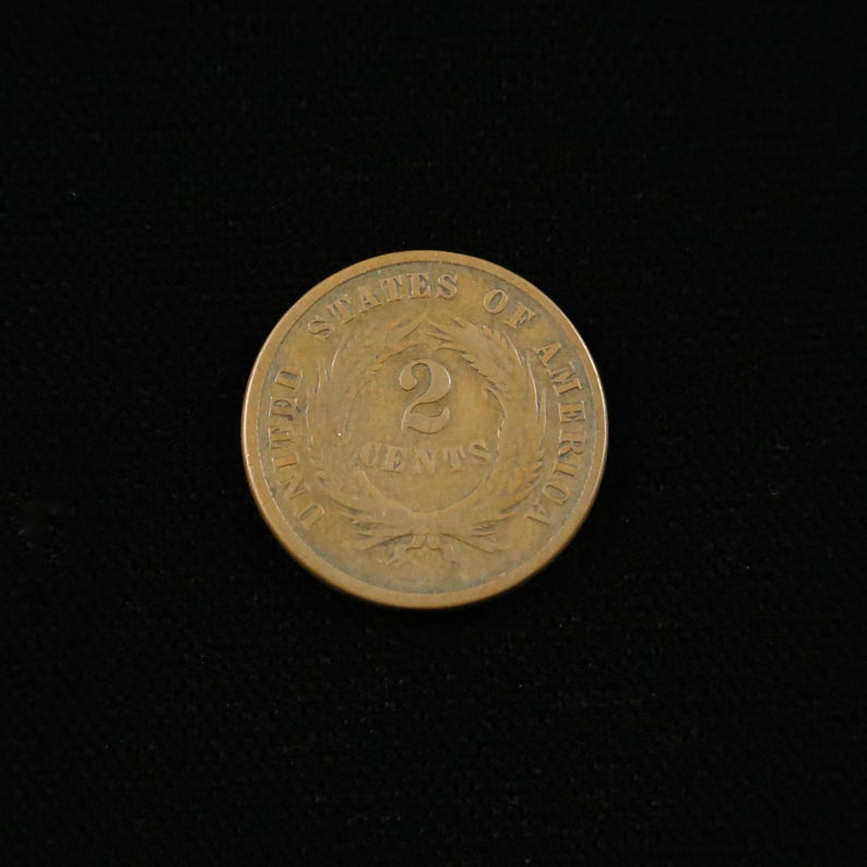 1865 Civil War Era Two Cent Coin with a fancy design, in good condition, raw from Black Market LLC.
