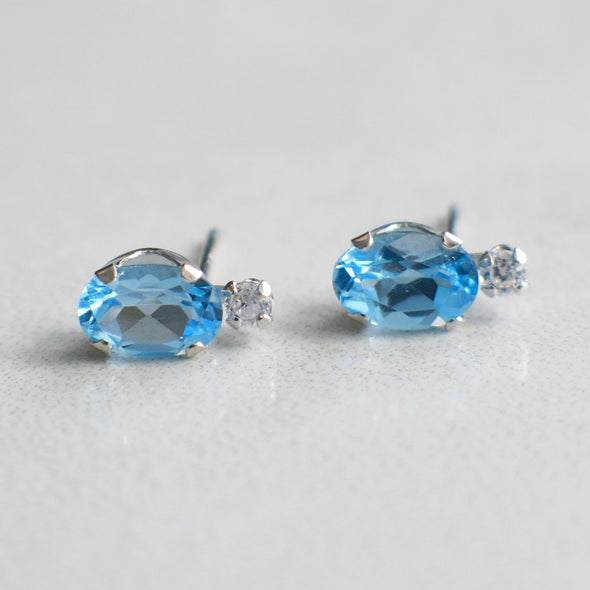 10K White Gold Oval Blue Topaz and CZ Stud Earrings
