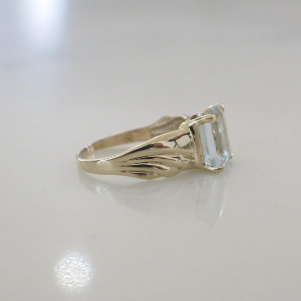 Emerald Cut Sky Blue Topaz Solitaire 10K Yellow Gold Ring