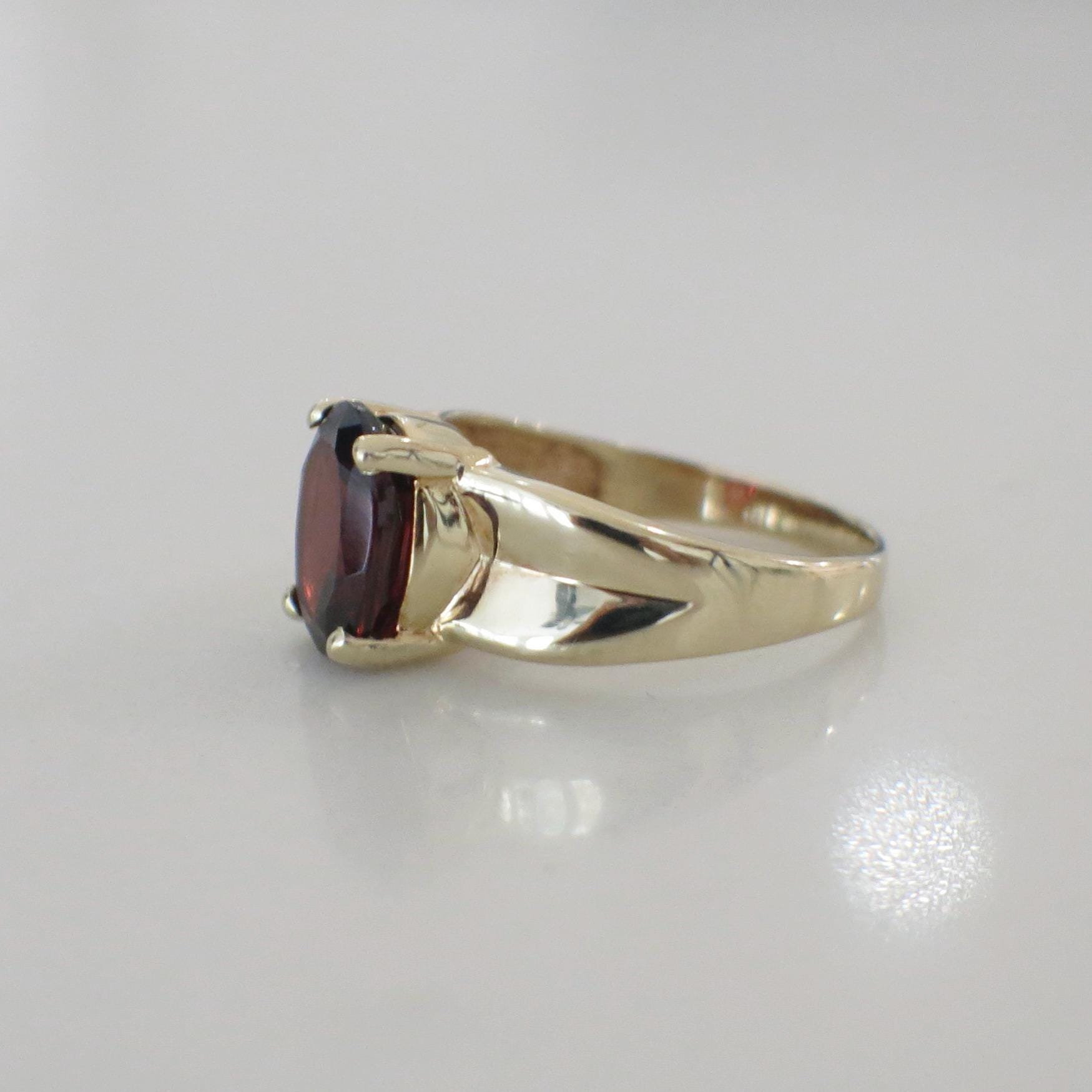 14K Yellow Gold Garnet Solitaire Ring – Oval Red January Birthstone - Black Market LLC