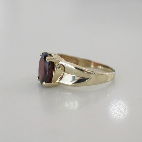 14K Yellow Gold Garnet Solitaire Ring – Oval Red January Birthstone