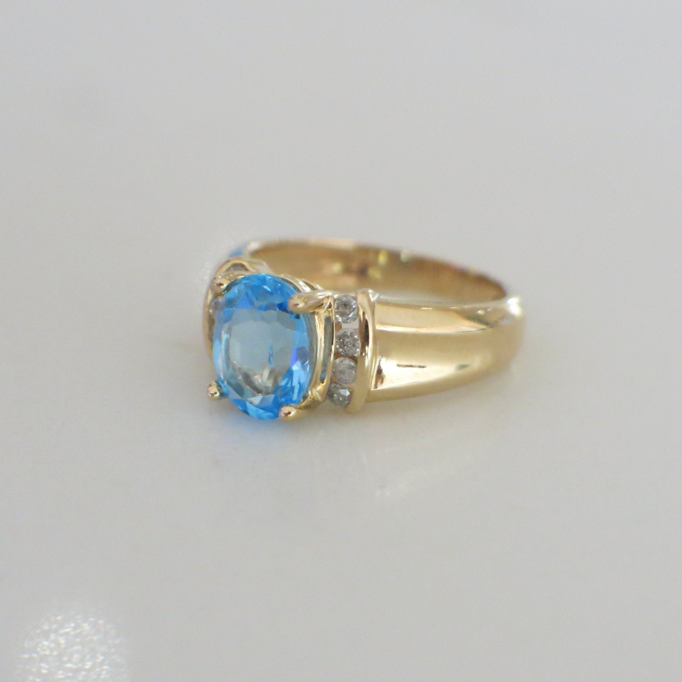 14K Yellow Gold Swiss Blue Topaz and Diamond Oval Ring – Size 6 - Black Market LLC