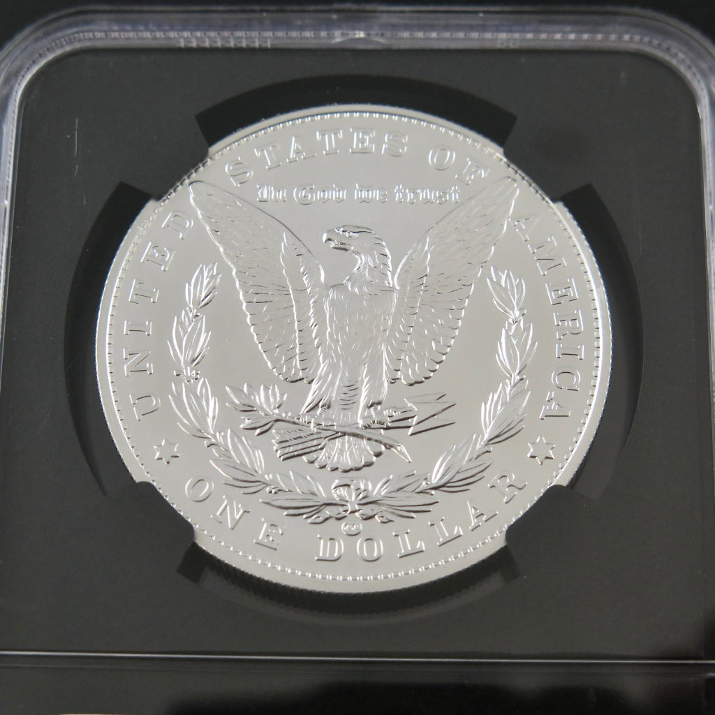 2021 Morgan Silver Dollar commemorative coin, NGC MS70, signed by Edmund Moy, showcasing detailed design and silver finish.