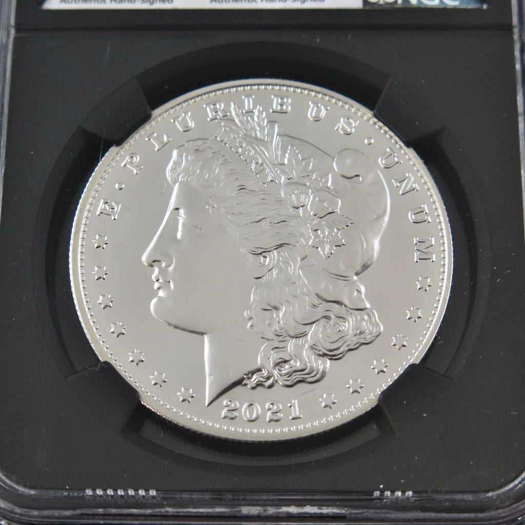 2021-S Morgan Silver Dollar commemorative coin in MS70 grade with NGC advanced signature, featuring detailed eagle design.