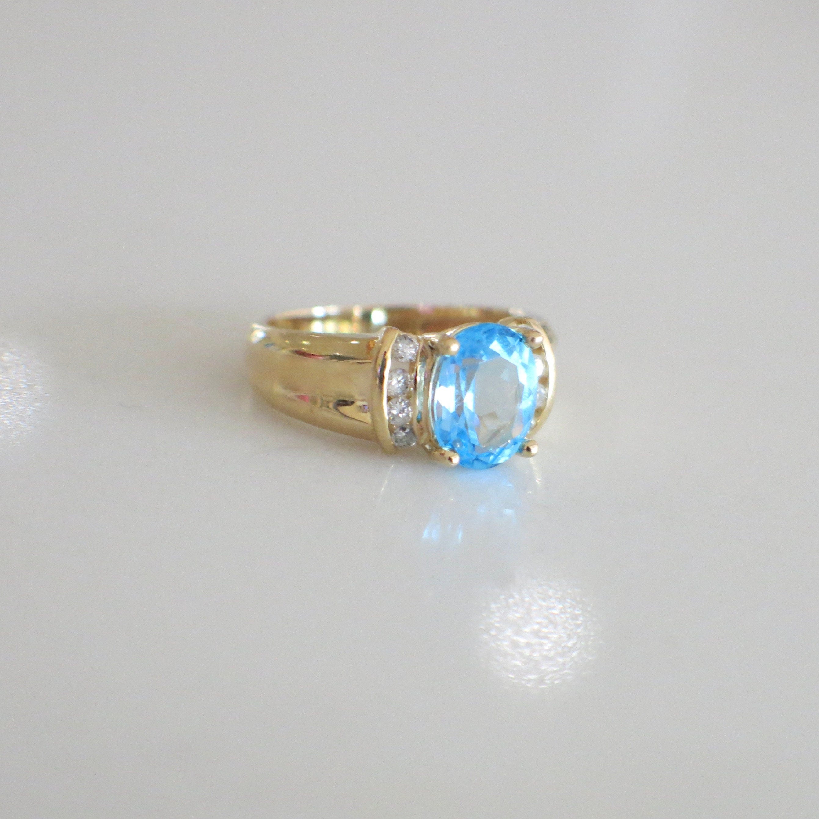 14K Yellow Gold Swiss Blue Topaz and Diamond Oval Ring – Size 6 - Black Market LLC