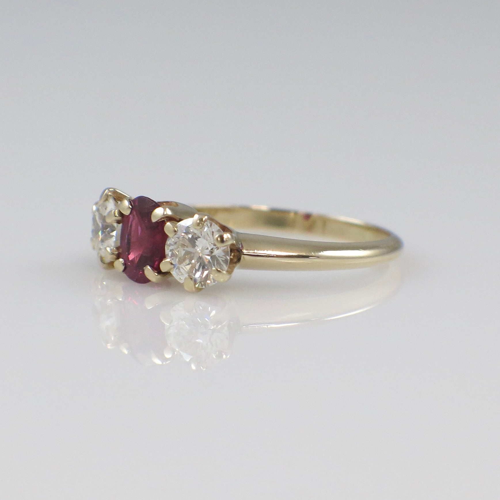 14K yellow gold ruby and diamond three-stone ring with vintage style, 1.00 carat total weight, size 5.75, by Black Market LLC.