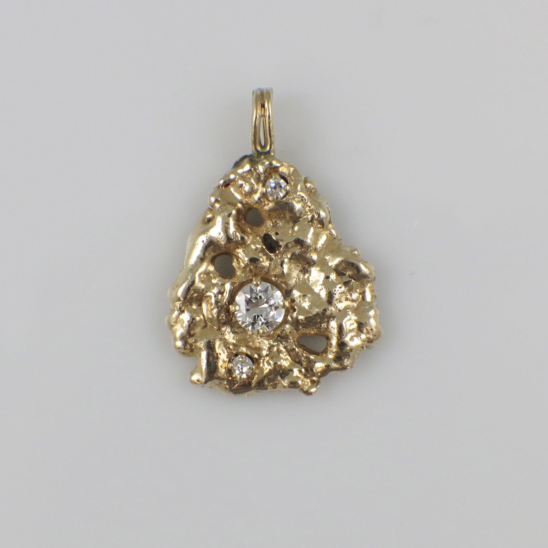 14K yellow gold nugget diamond pendant with 0.53 CTW natural diamonds, featuring a unique textured design and sparkling accents.