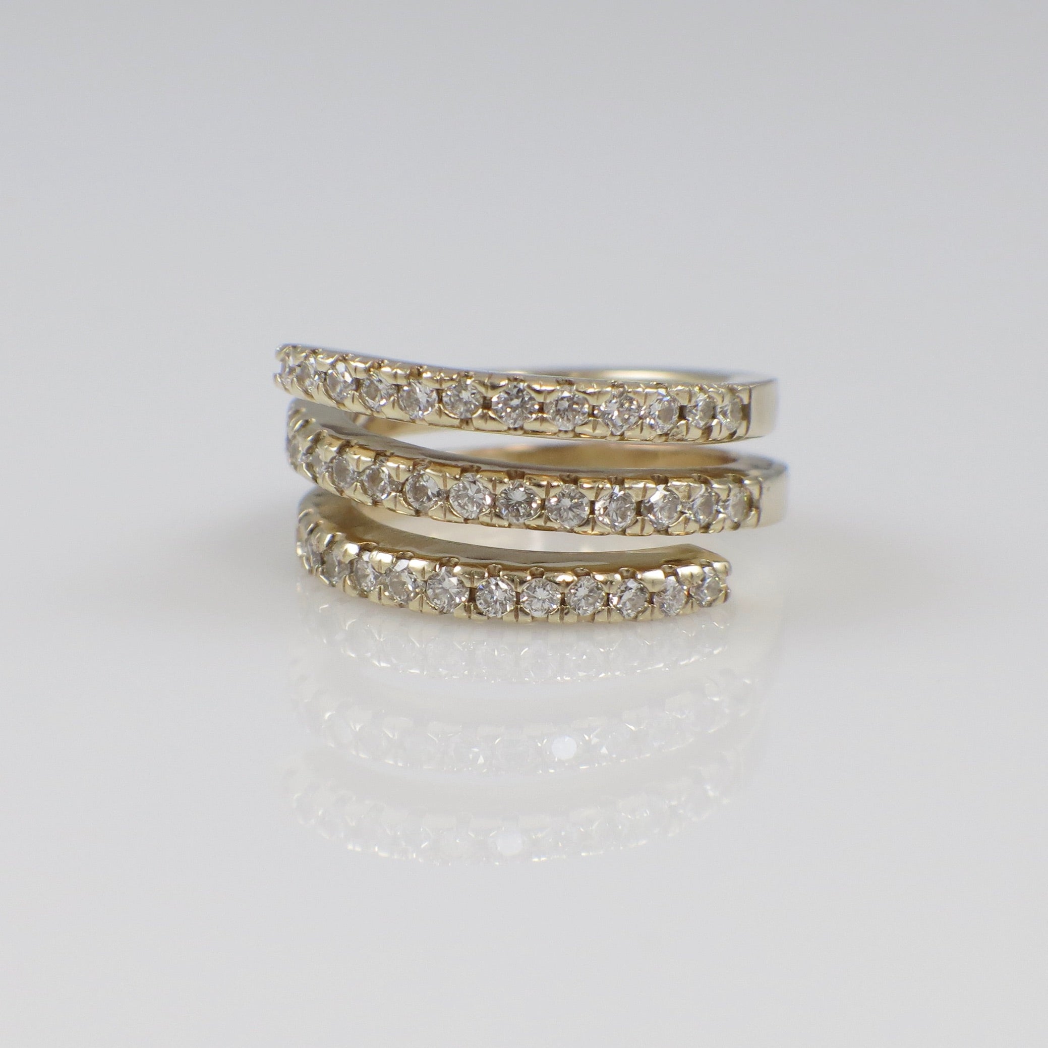 14K yellow gold cubic zirconia wrap ring with triple band design, size 4, by Black Market LLC.