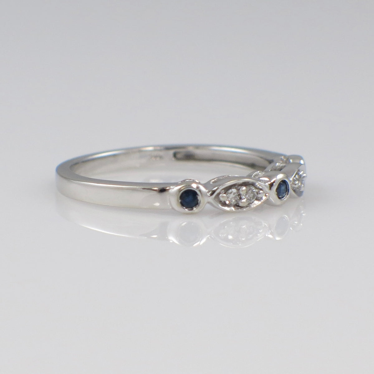 10K white gold diamond and sapphire vintage bezel stackable ring in size 6.75, featuring elegant gemstone accents.