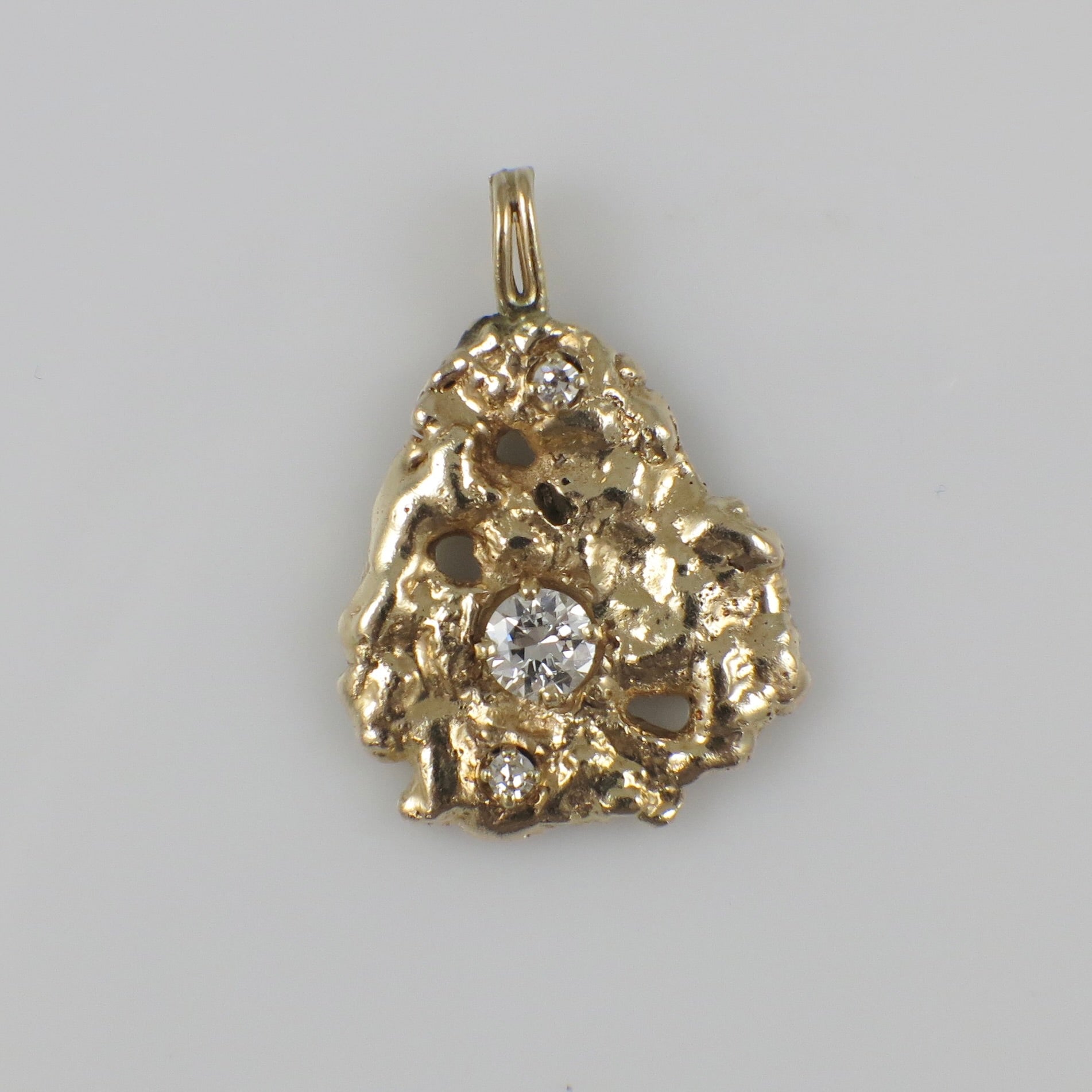 14K yellow gold nugget diamond pendant with 0.53 CTW natural diamonds, elegant jewelry piece from Black Market LLC.