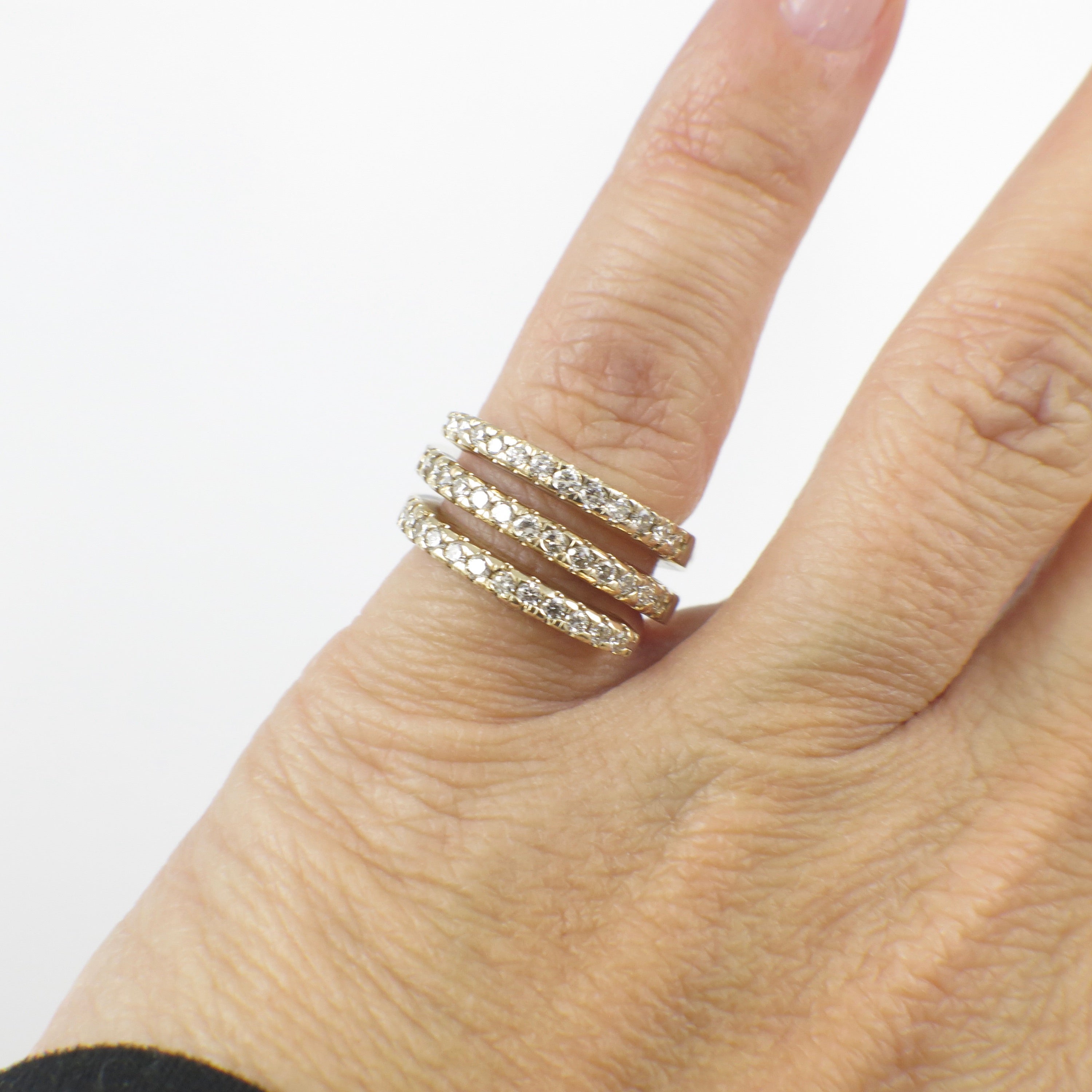 14K yellow gold CZ wrap ring with triple band design and cubic zirconia accents, size 4, by Black Market LLC.