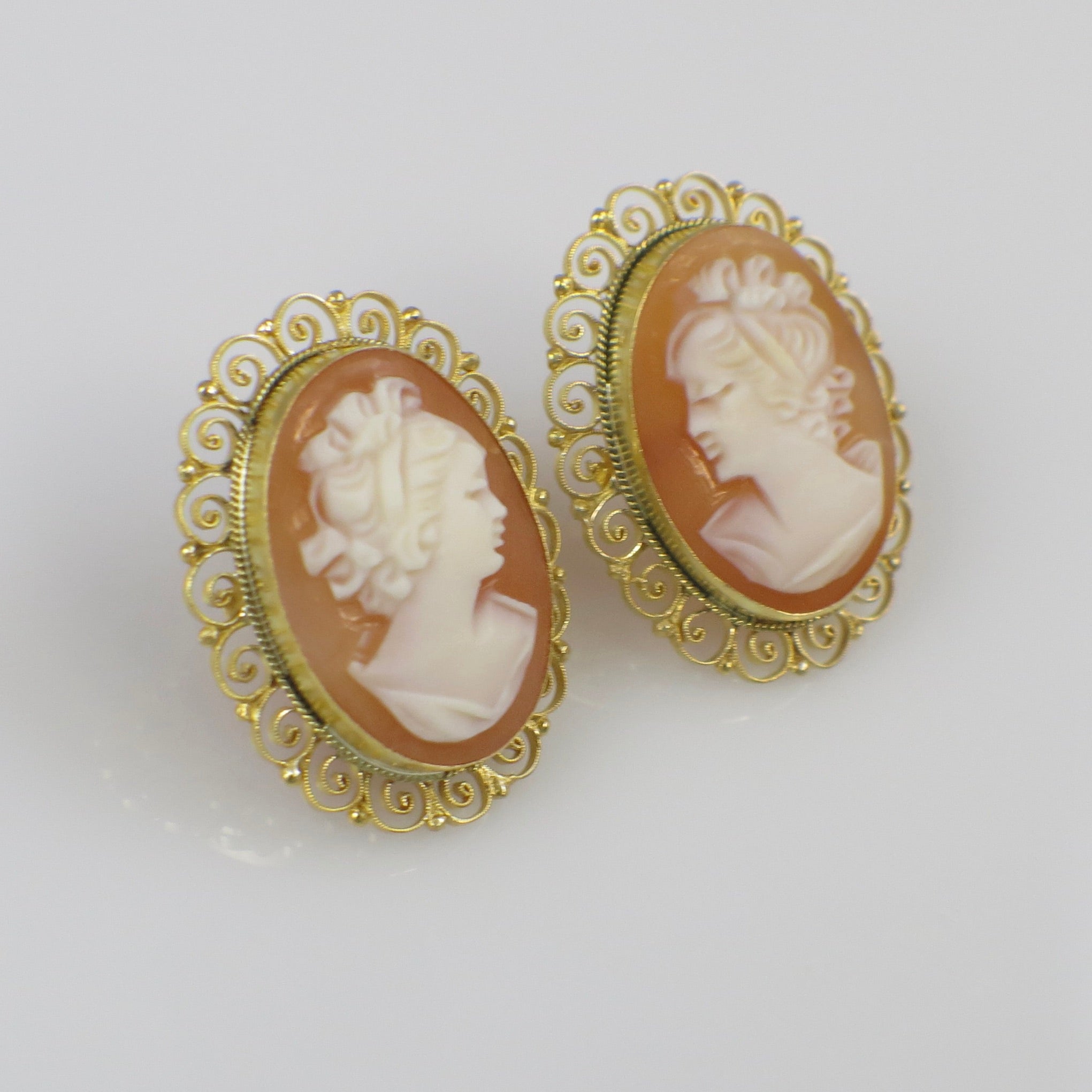 Italian hand-carved shell cameo filigree earrings in 18K gold featuring intricate vintage design and delicate craftsmanship.