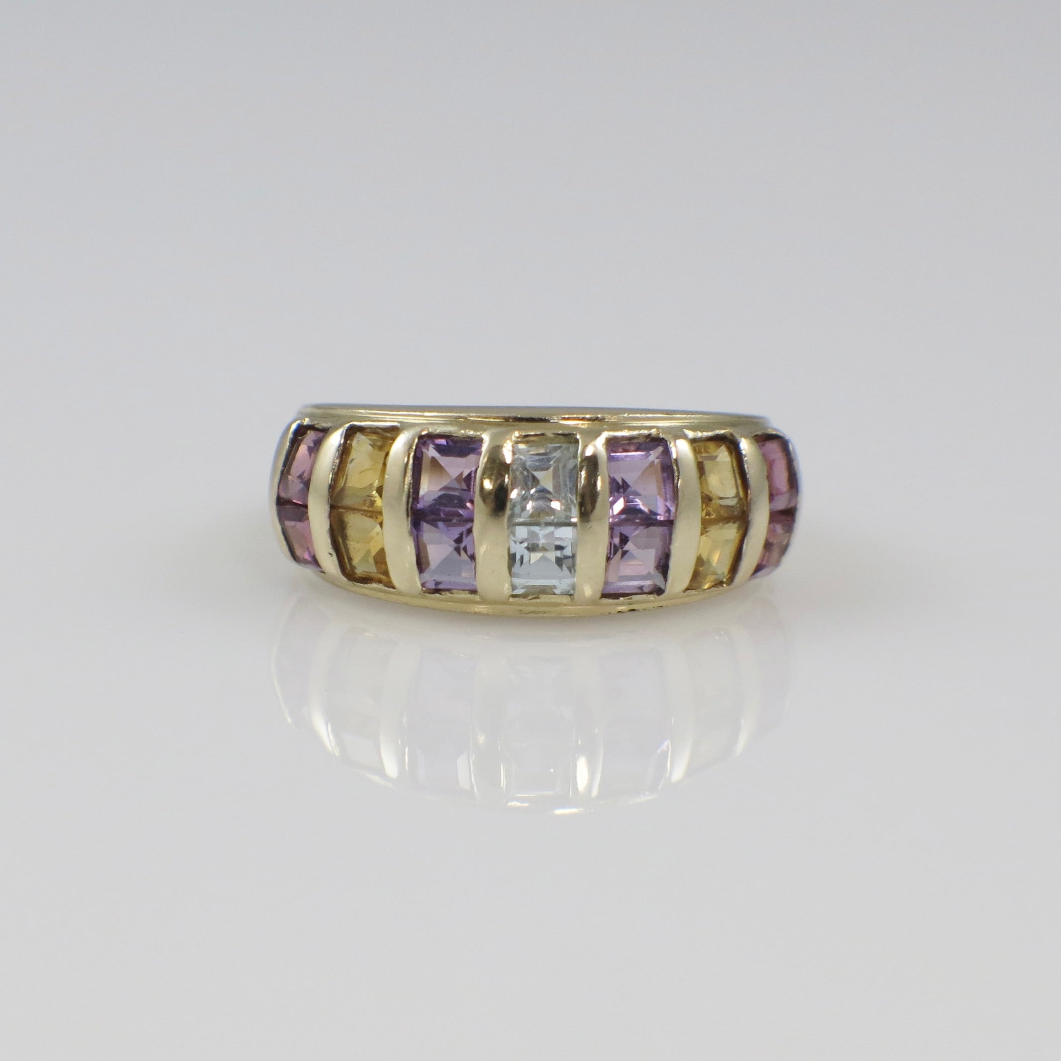 Vintage 14K yellow gold multi-gemstone princess cut ring featuring vibrant gemstones and intricate design from Black Market LLC.
