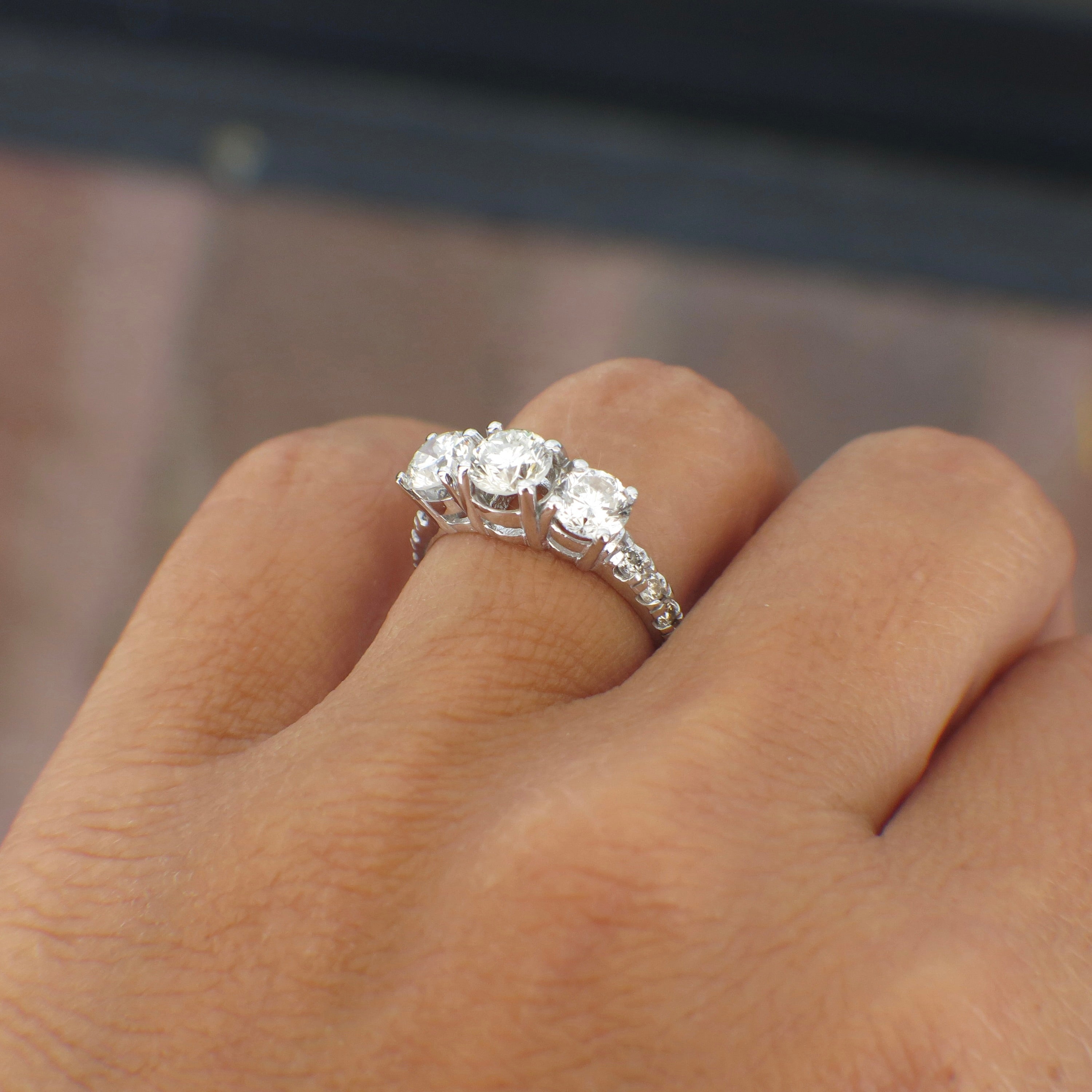 Vintage Lillian James bridal 18K white gold three stone diamond engagement ring with 1.92 CTW featuring three sparkling diamonds.