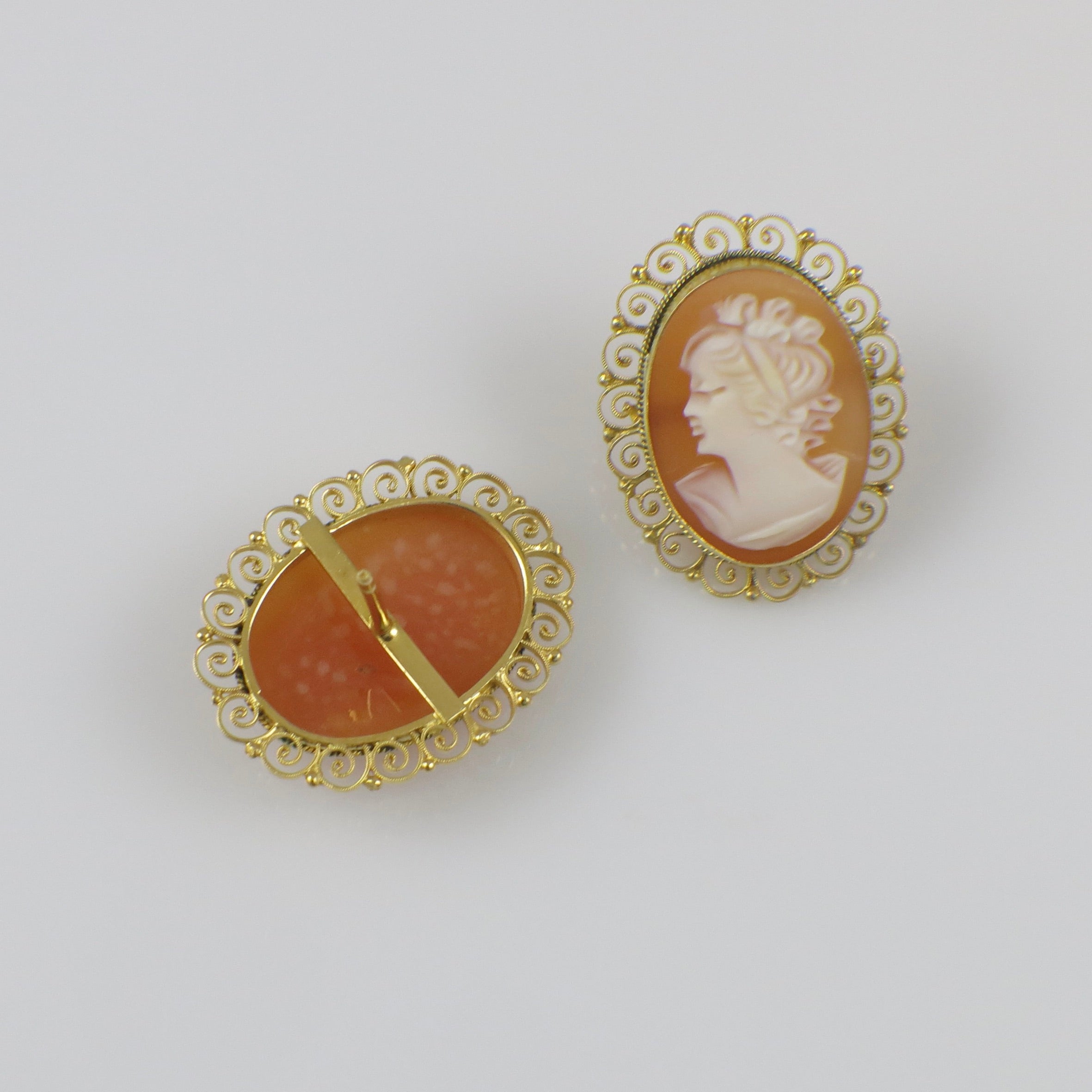 Italian hand-carved shell cameo earrings with intricate gold filigree details in 18K gold, featuring vintage-inspired jewelry design.