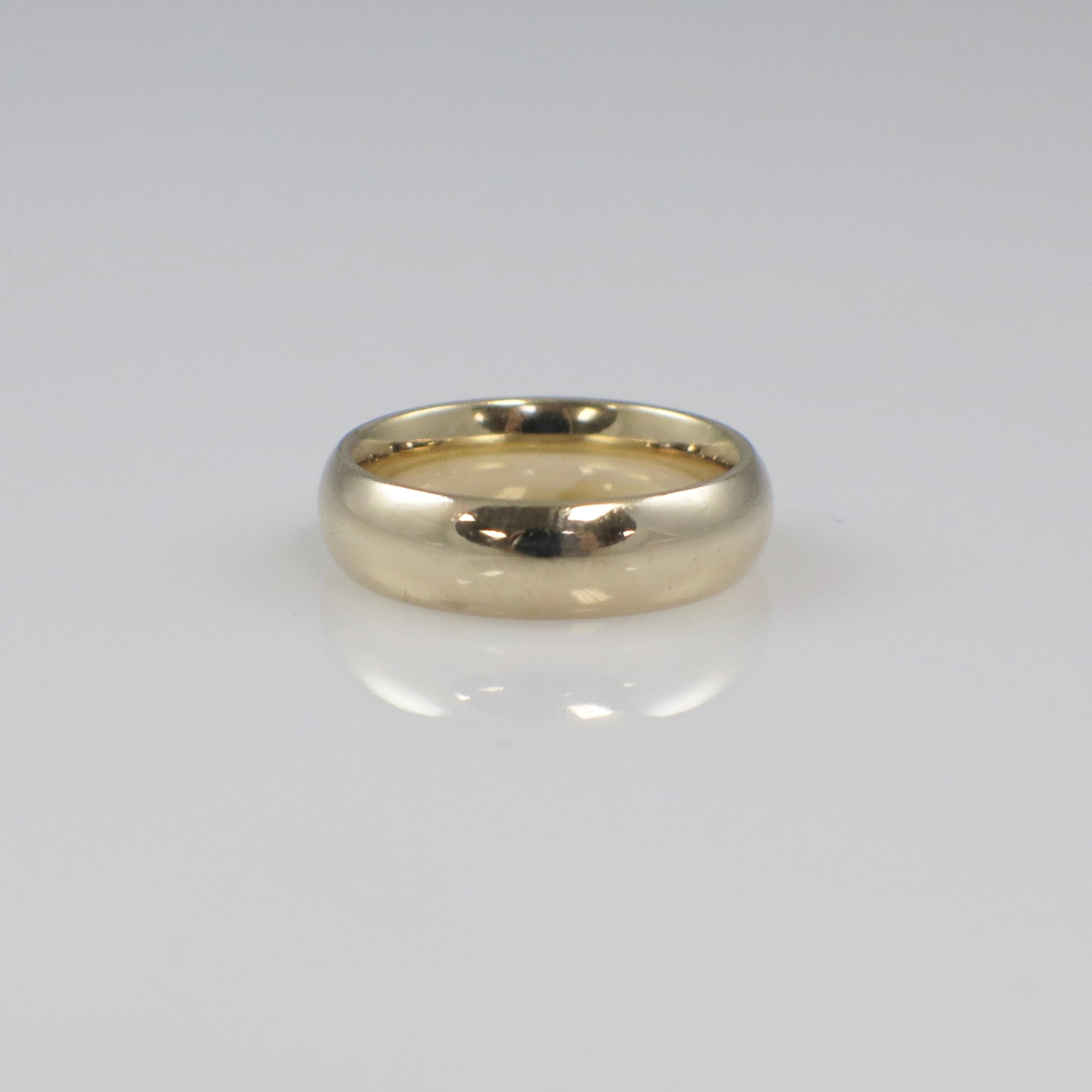 14K yellow gold wedding band ring with 5mm width, size 5, featuring a classic gold band design by Black Market LLC.