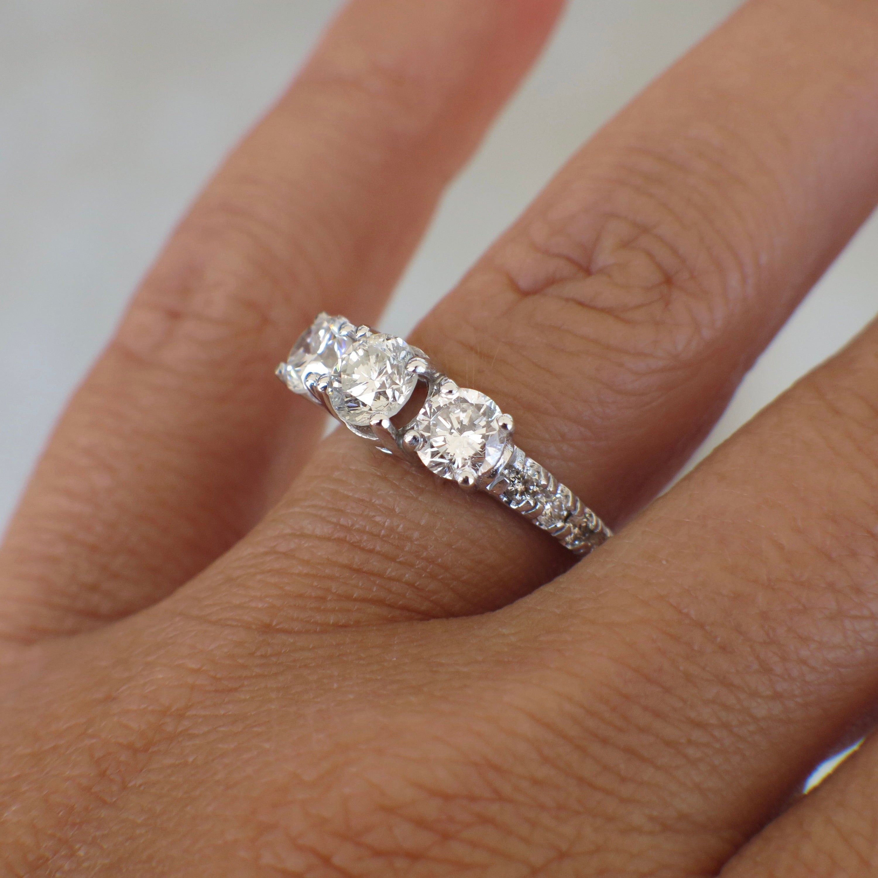 Vintage Lillian James Bridal 18K white gold three-stone diamond engagement ring with 1.92 CTW, showcasing sparkling center and side diamonds.