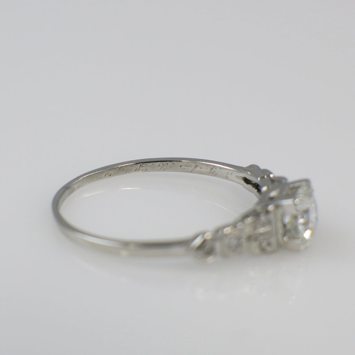 Art Deco platinum diamond engagement ring by Black Market LLC, featuring a 0.63 CTW diamond setting
