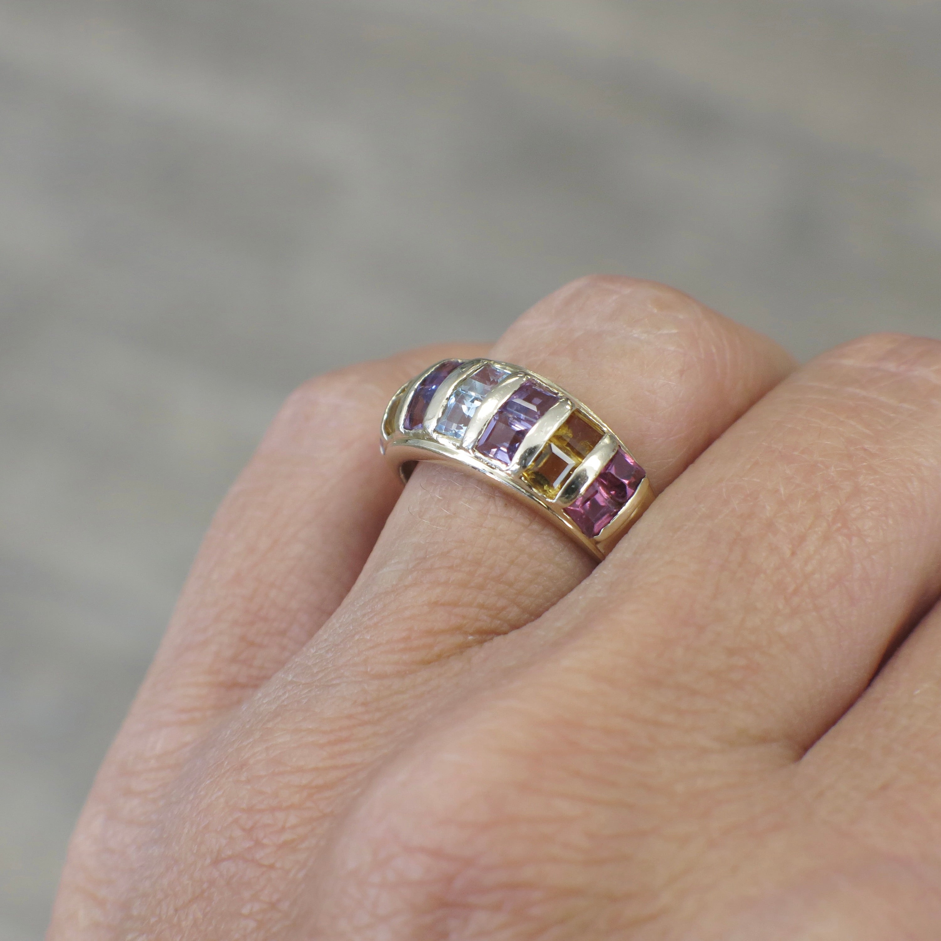 Vintage 14K yellow gold multi-gemstone princess cut ring with colorful gemstones, crafted by Black Market LLC.