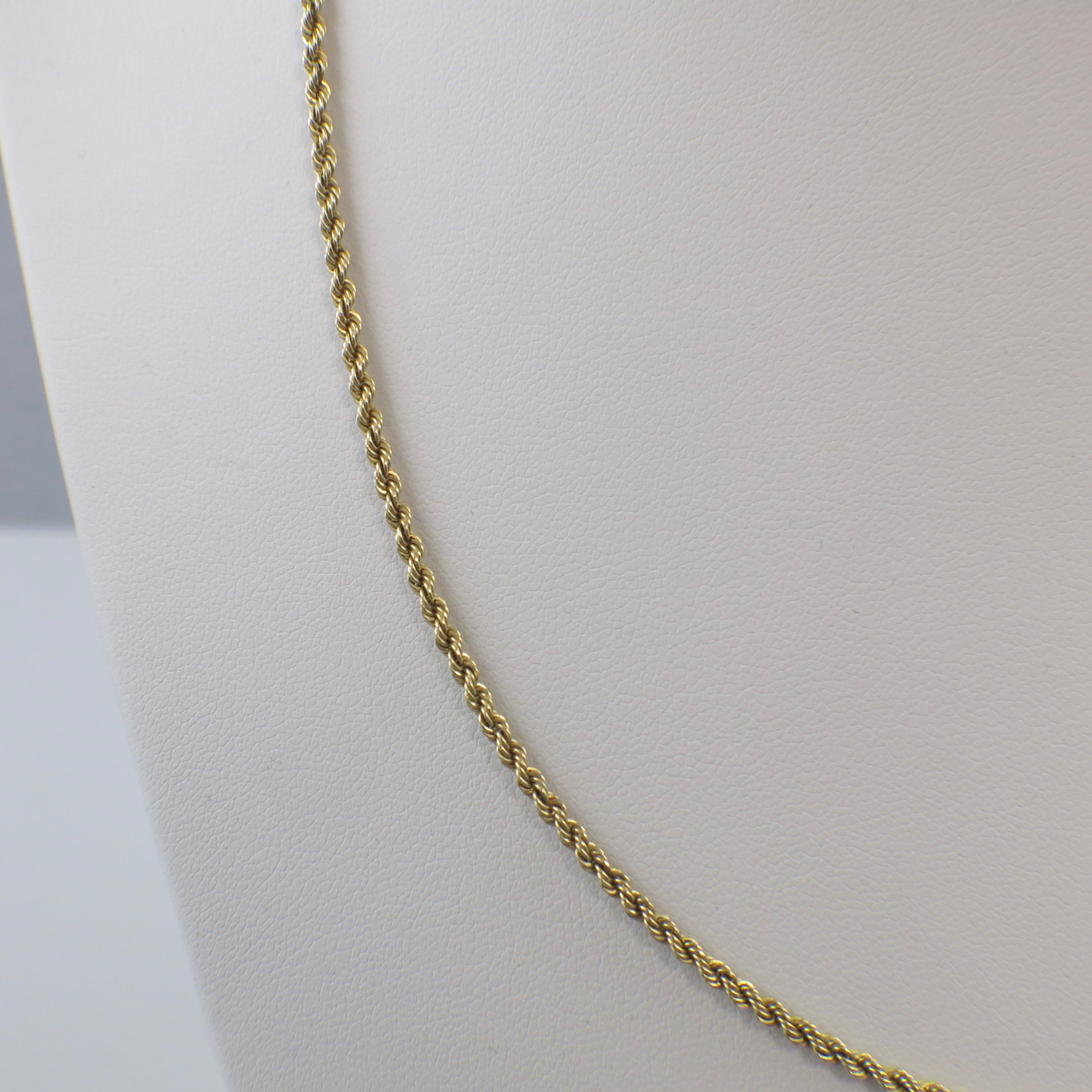 14K yellow gold 24-inch 2mm rope chain necklace with a solid gold finish, featuring a classic twisted design.