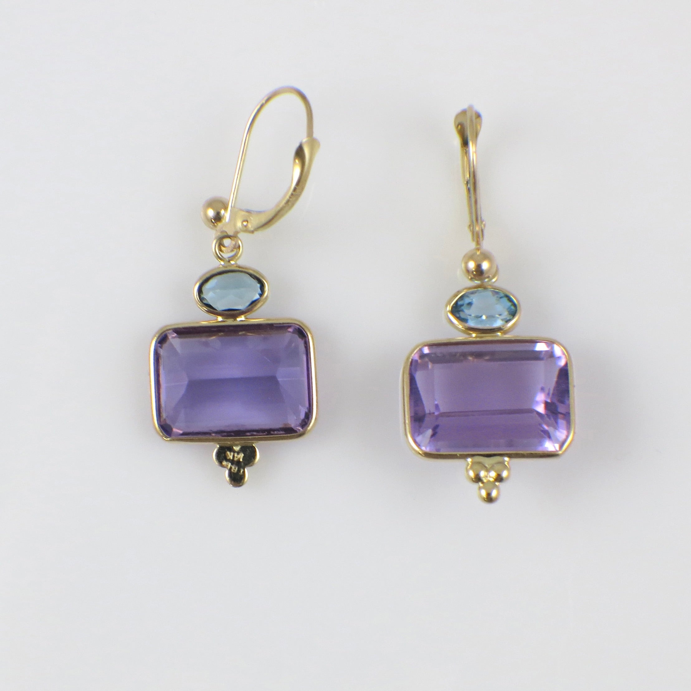 Vintage 14K yellow gold amethyst and topaz drop earrings with intricate detailing, showcasing elegant jewelry design.