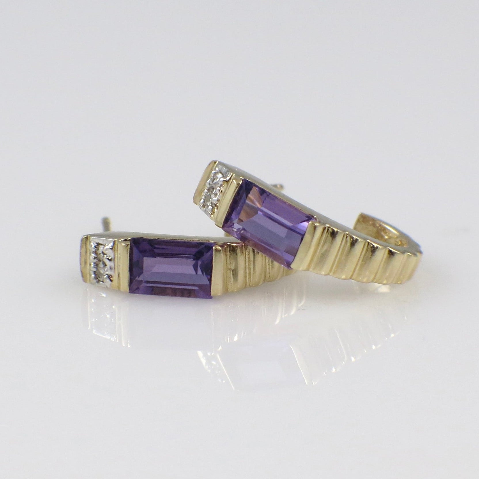 Vintage 14K yellow gold amethyst and diamond J hoop earrings with intricate detailing, crafted by Black Market LLC.
