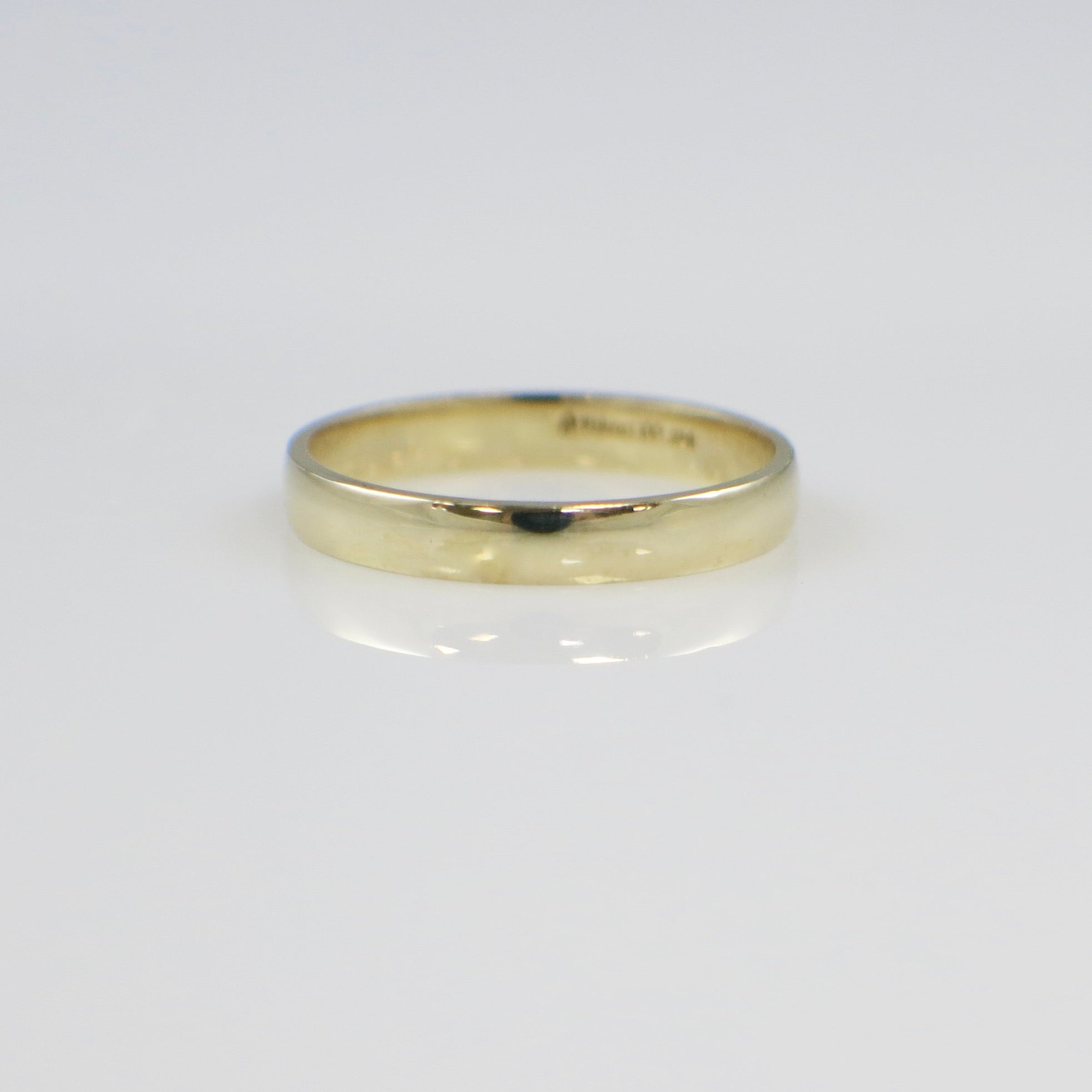 Gold ring on a white background