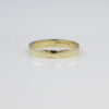Gold ring on a white background