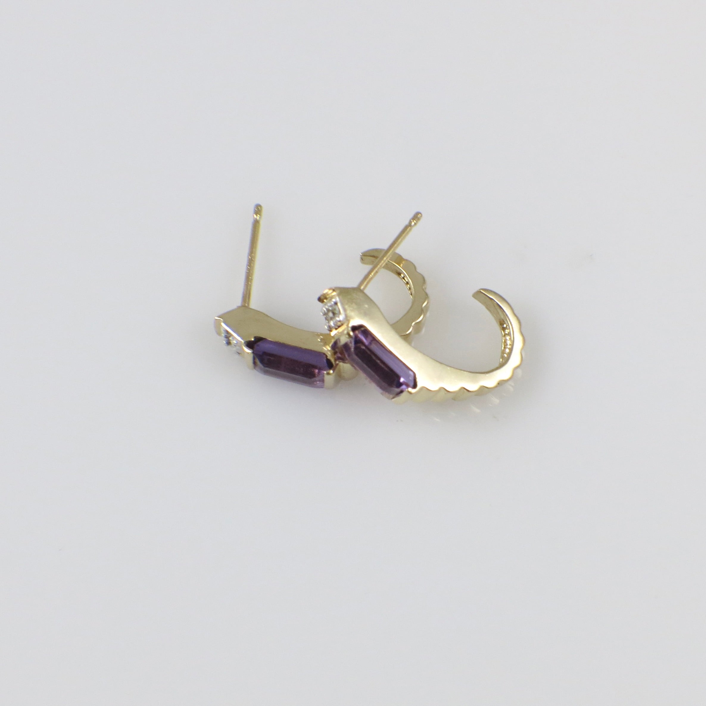 Vintage 14K yellow gold amethyst and diamond J hoop earrings featuring elegant gemstone accents and classic hoop design.