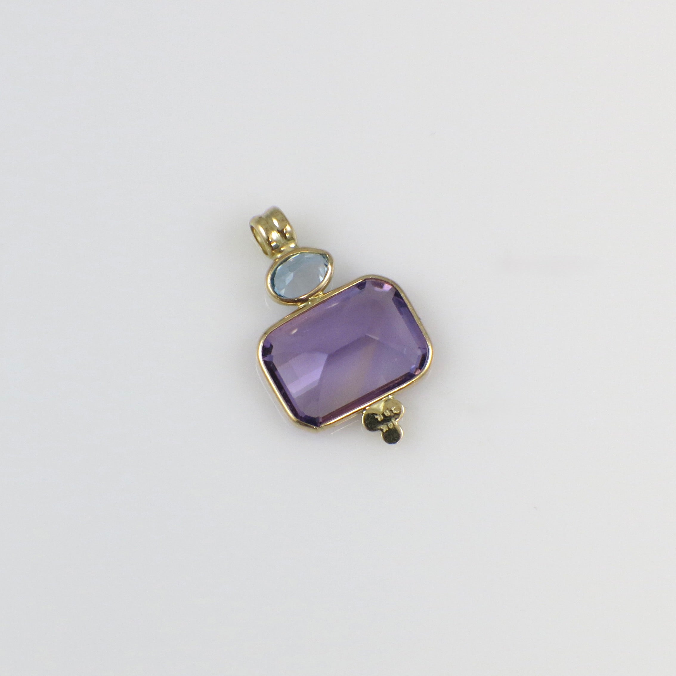 Vintage 14K yellow gold amethyst and Swiss blue topaz pendant necklace with intricate design and gemstone details.