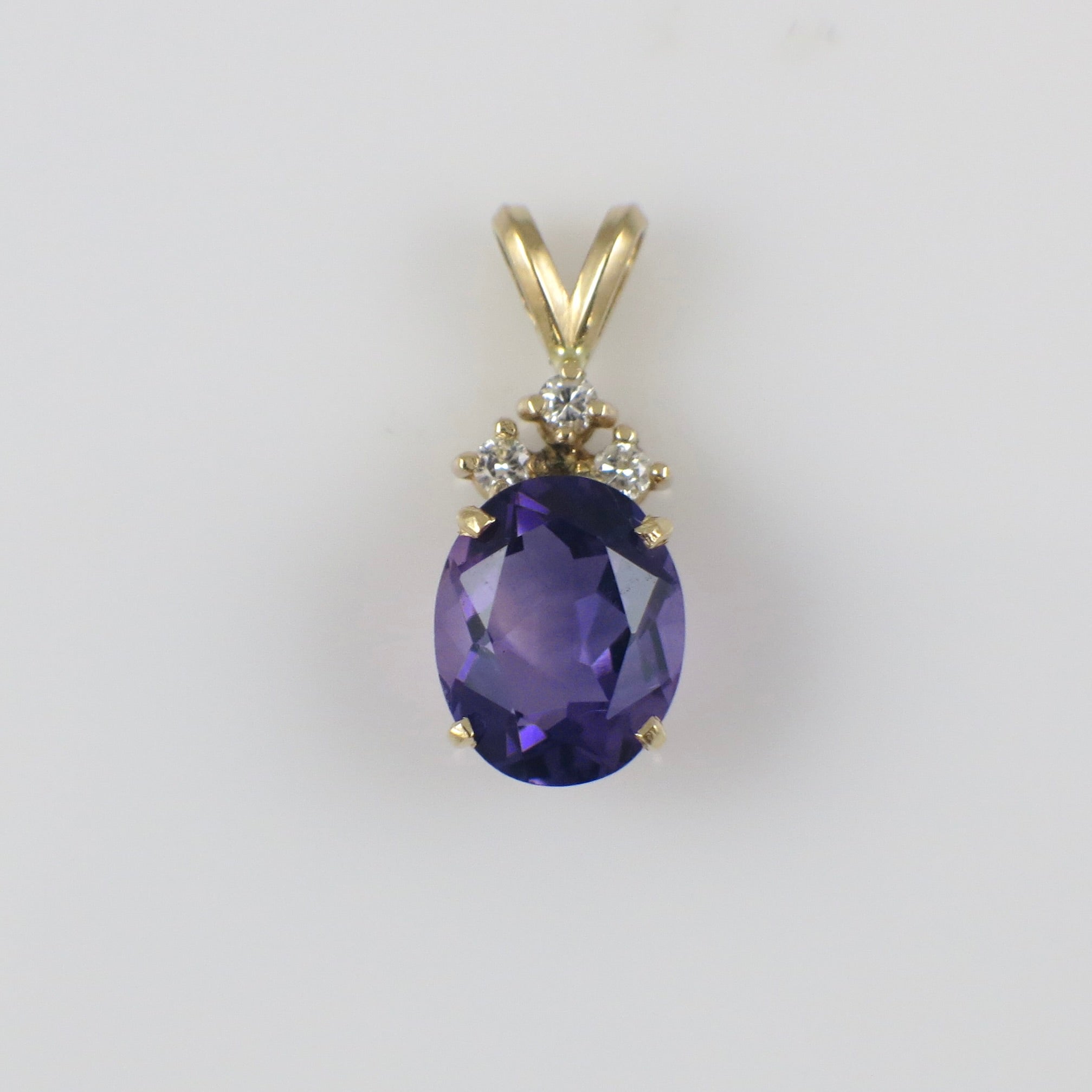 Vintage 14K yellow gold amethyst and diamond pendant necklace with intricate design, crafted by Black Market LLC.