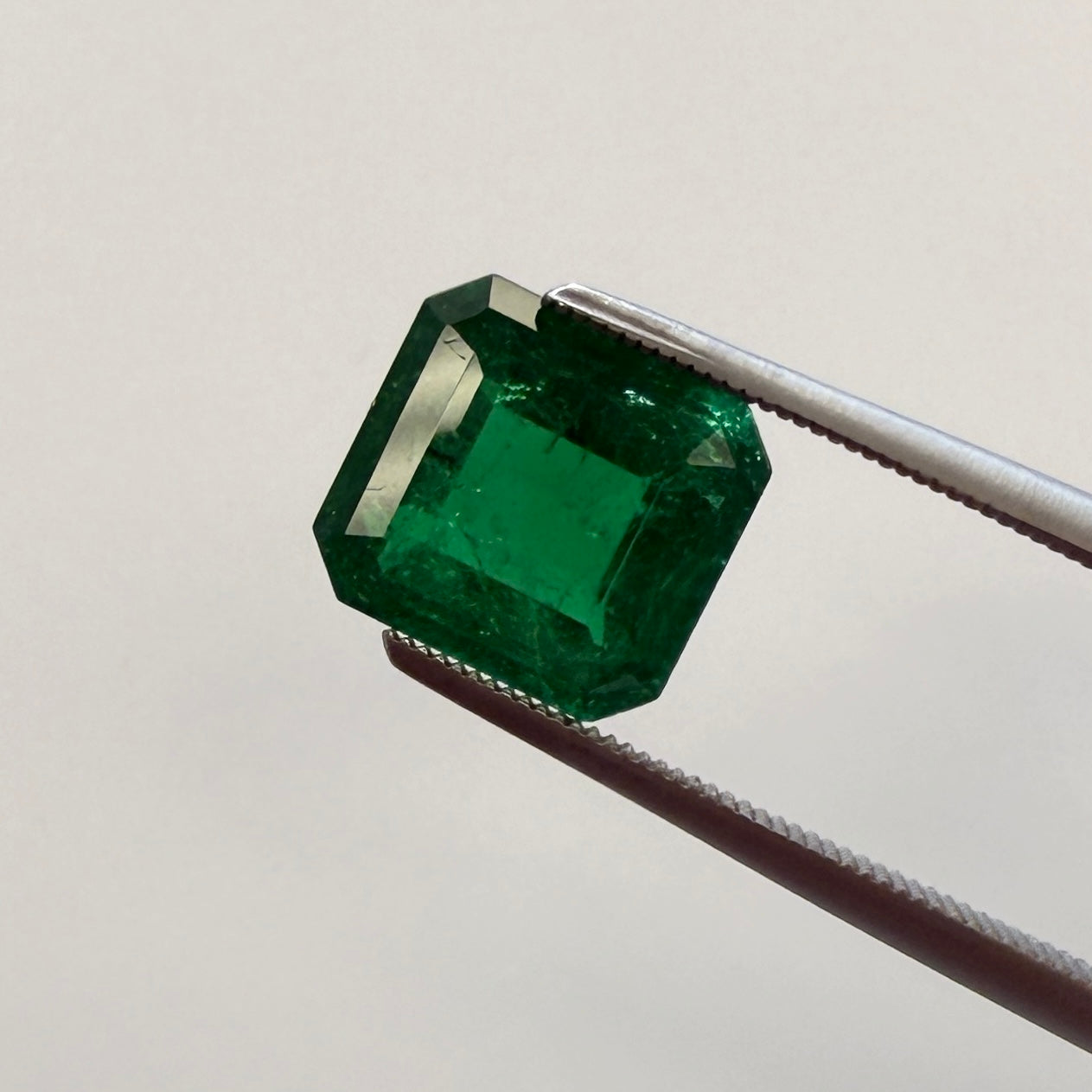 GIA Certified 2.43ct emerald gemstone with octagonal step cut, minor enhancement, size 8.44x7.85mm, from Black Market LLC.
