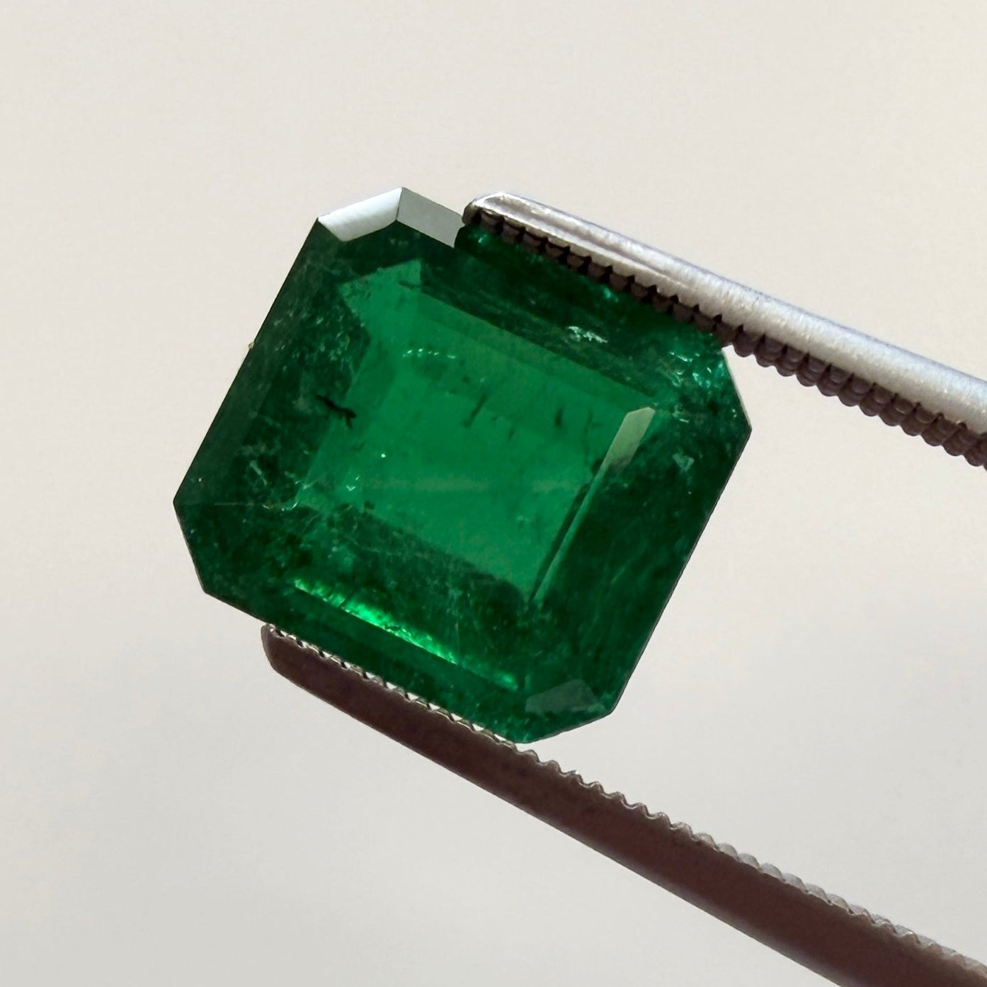 GIA Certified emerald gemstone, 2.43ct octagonal step cut, minor enhancement, measuring 8.44x7.85mm, from Black Market LLC.