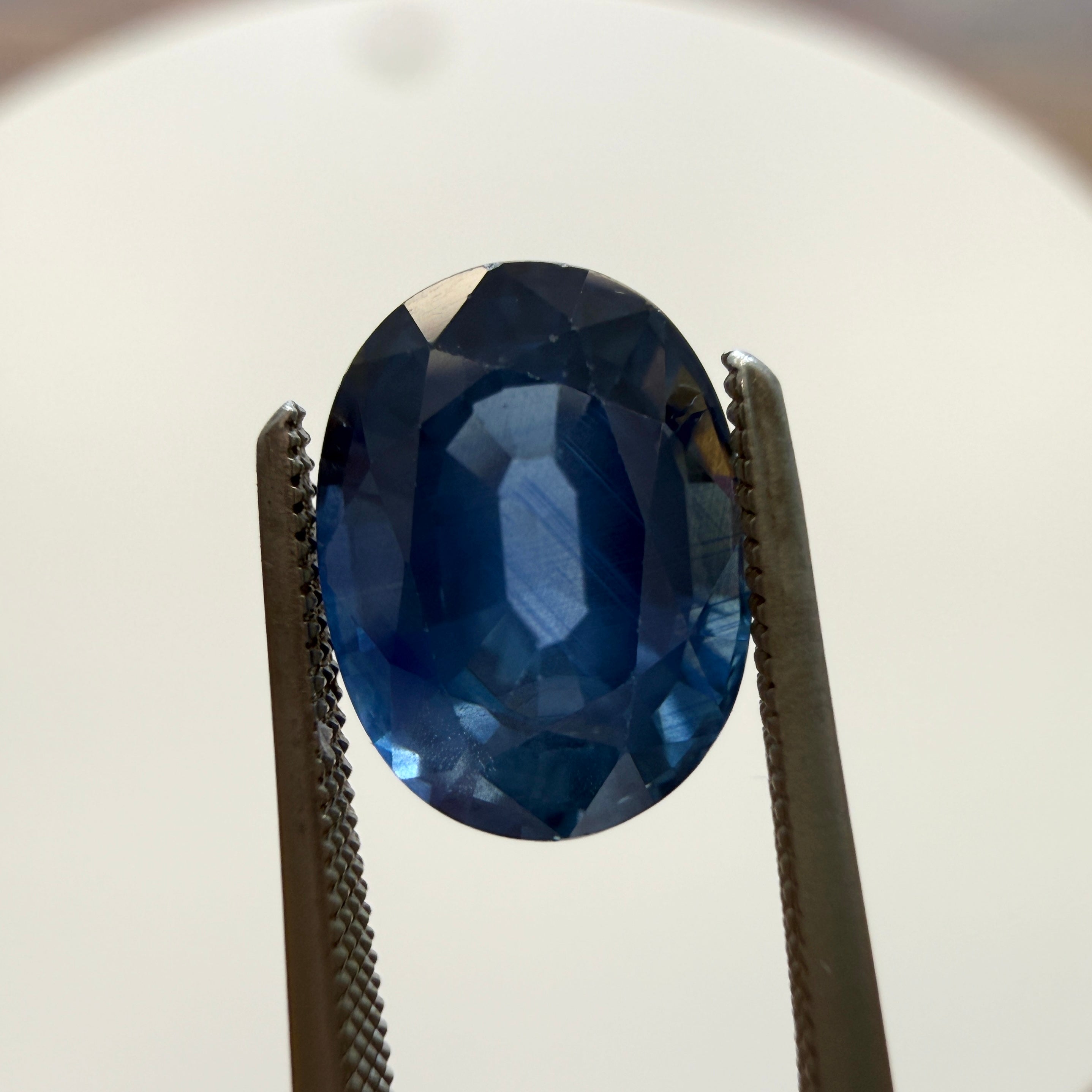 Oval GIA Blue Sapphire gemstone, 2.36ct heated natural sapphire from Black Market LLC, 8.70 x 6.47mm, vibrant blue gemstone image.
