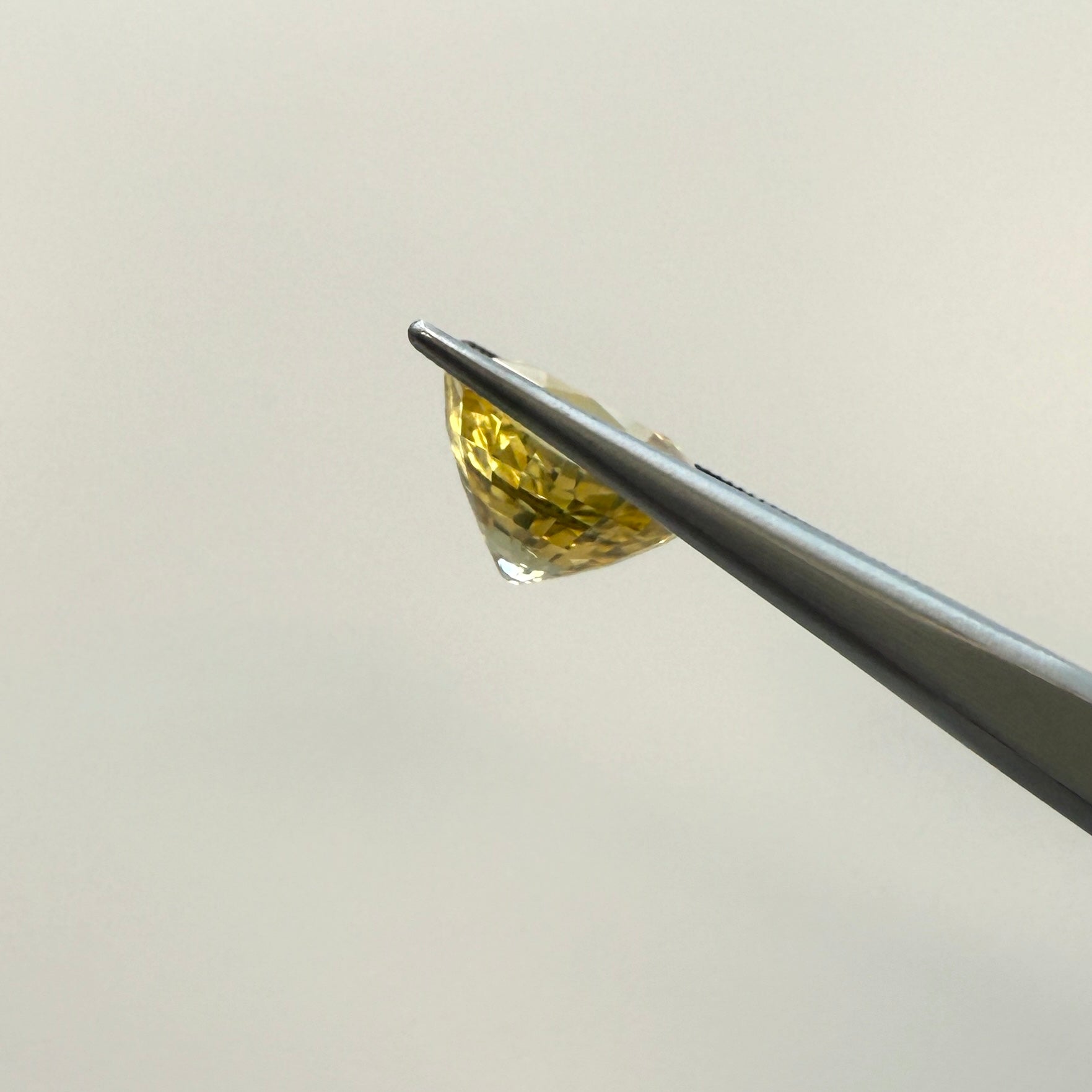 Oval GIA yellow sapphire gemstone, 4.10ct heated natural sapphire, vibrant yellow color, measured 9.77 x 8.56mm.