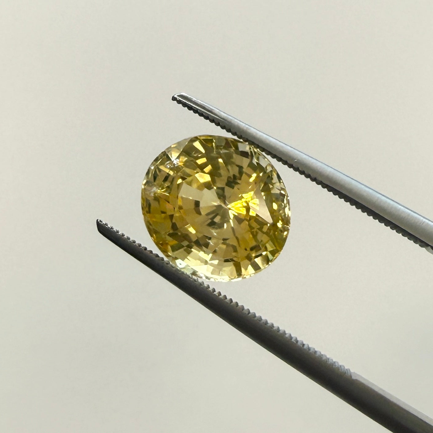 Oval GIA yellow sapphire gemstone, 4.10ct, heated natural yellow sapphire from Black Market LLC, 9.77 x 8.56mm, gemstone image