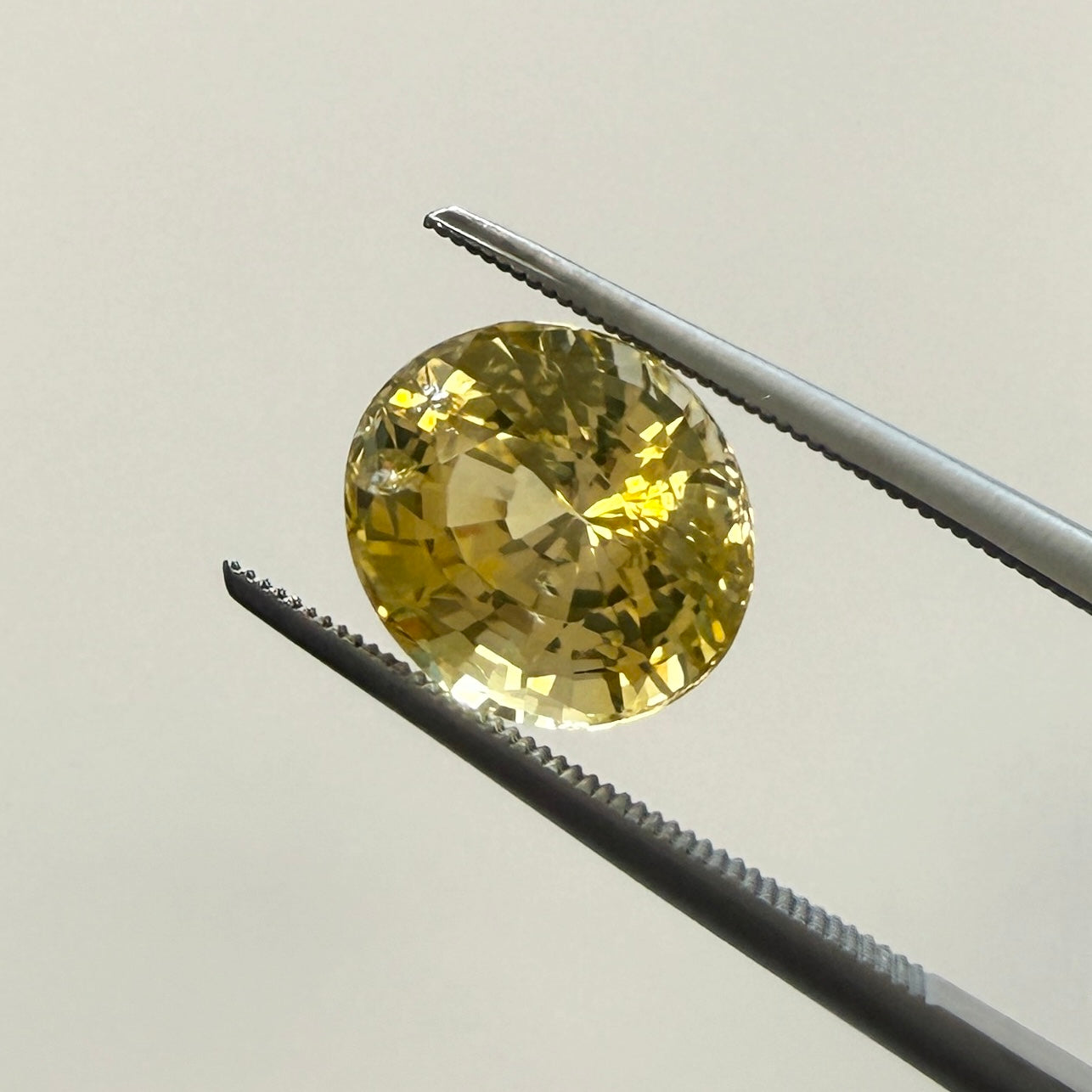 Oval GIA Yellow Sapphire gemstone, 4.10ct heated natural yellow sapphire from Black Market LLC, 9.77 x 8.56mm gemstone image.