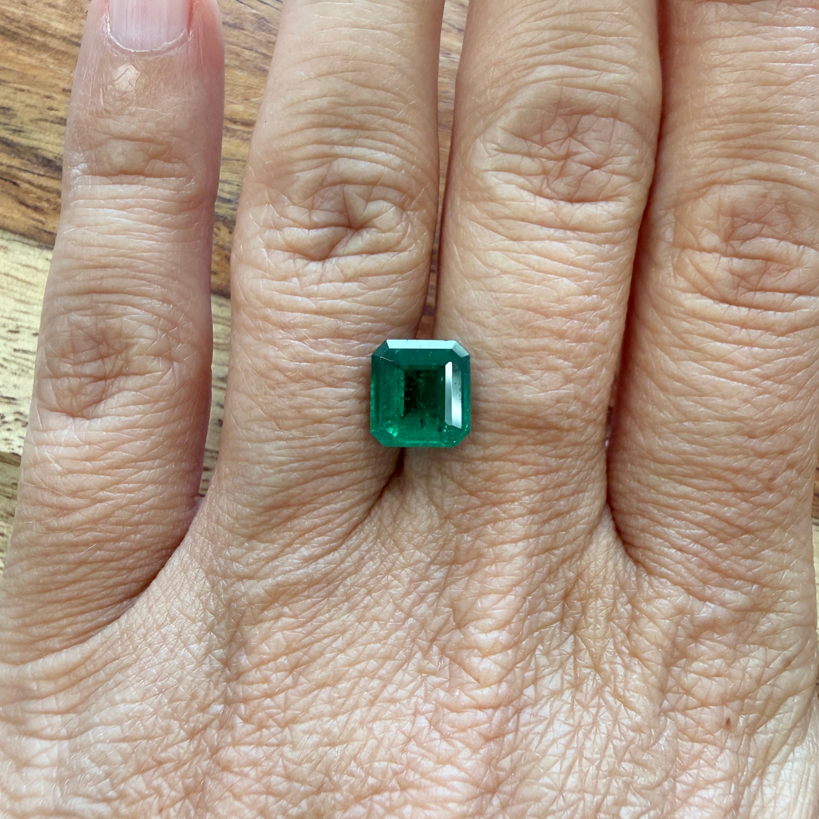 GIA Certified 2.43ct emerald gemstone with octagonal step cut, minor enhancement, size 8.44x7.85mm, from Black Market LLC.
