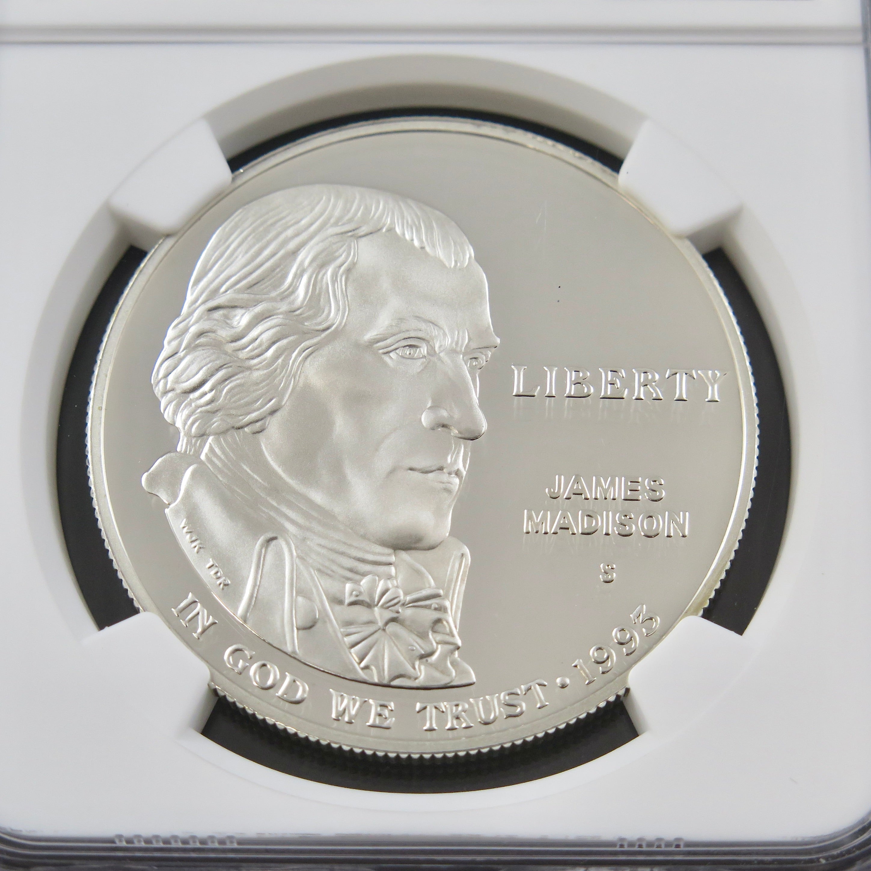 2003-S James Madison silver dollar commemorative coin in PF69 Ultra Cameo grade, showcasing detailed design and reflective surfaces.