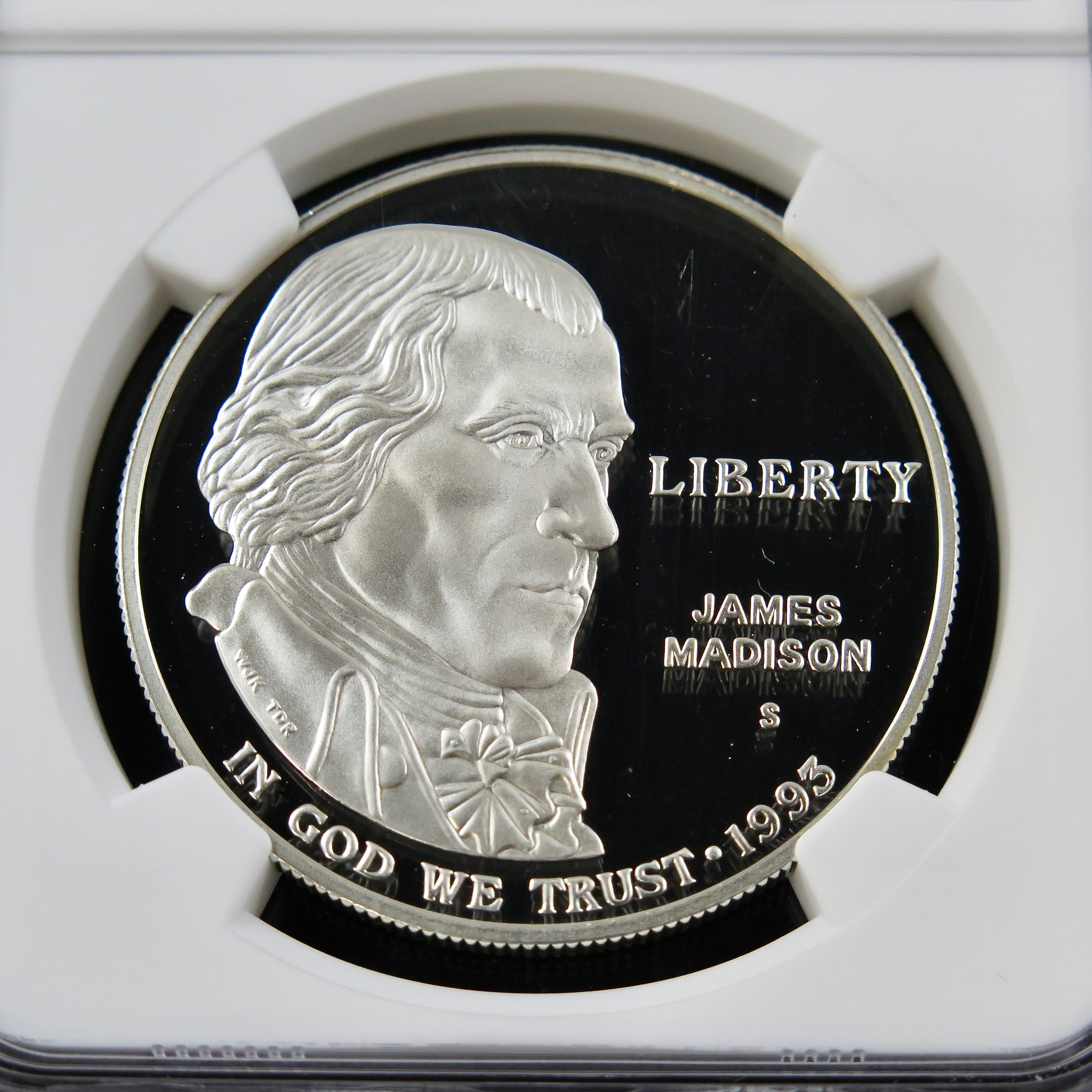 1993-S James Madison Silver Dollar commemorative coin with PF69 Ultra Cameo grade, showcasing detailed design and reflective surfaces.