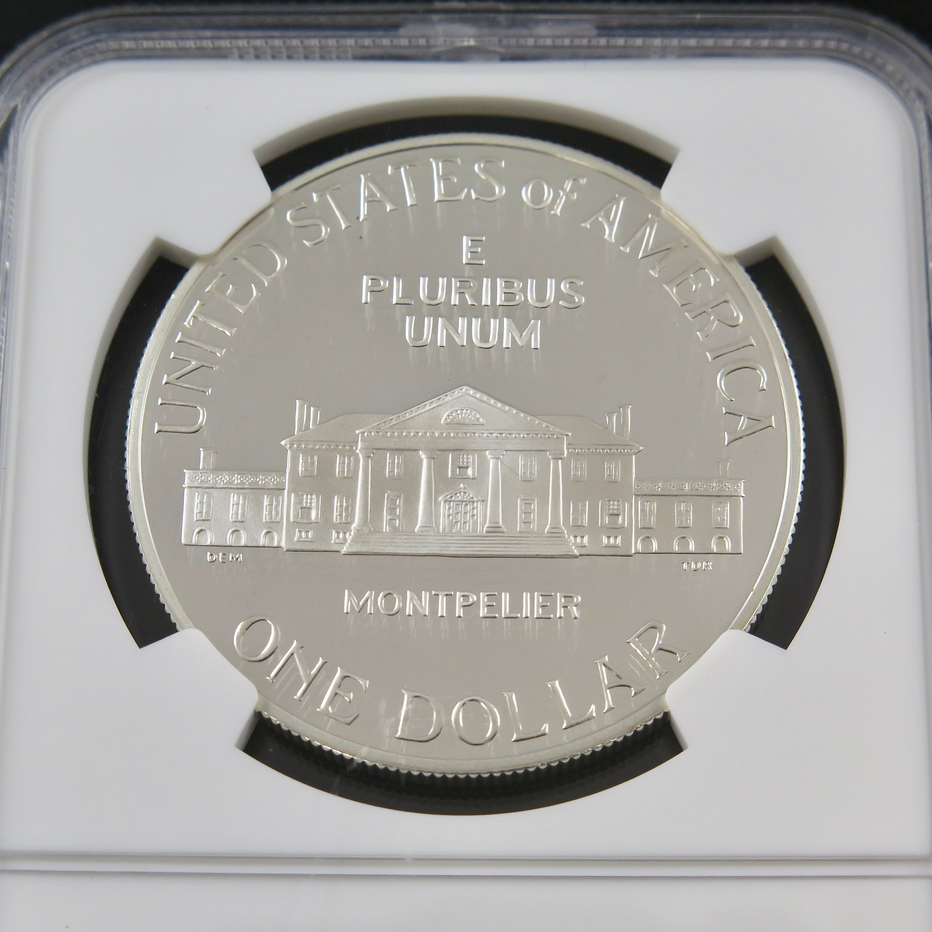 1993-S James Madison silver dollar commemorative coin with NGC Ultra Cameo PF69 grade, showcasing detailed design and heritage.