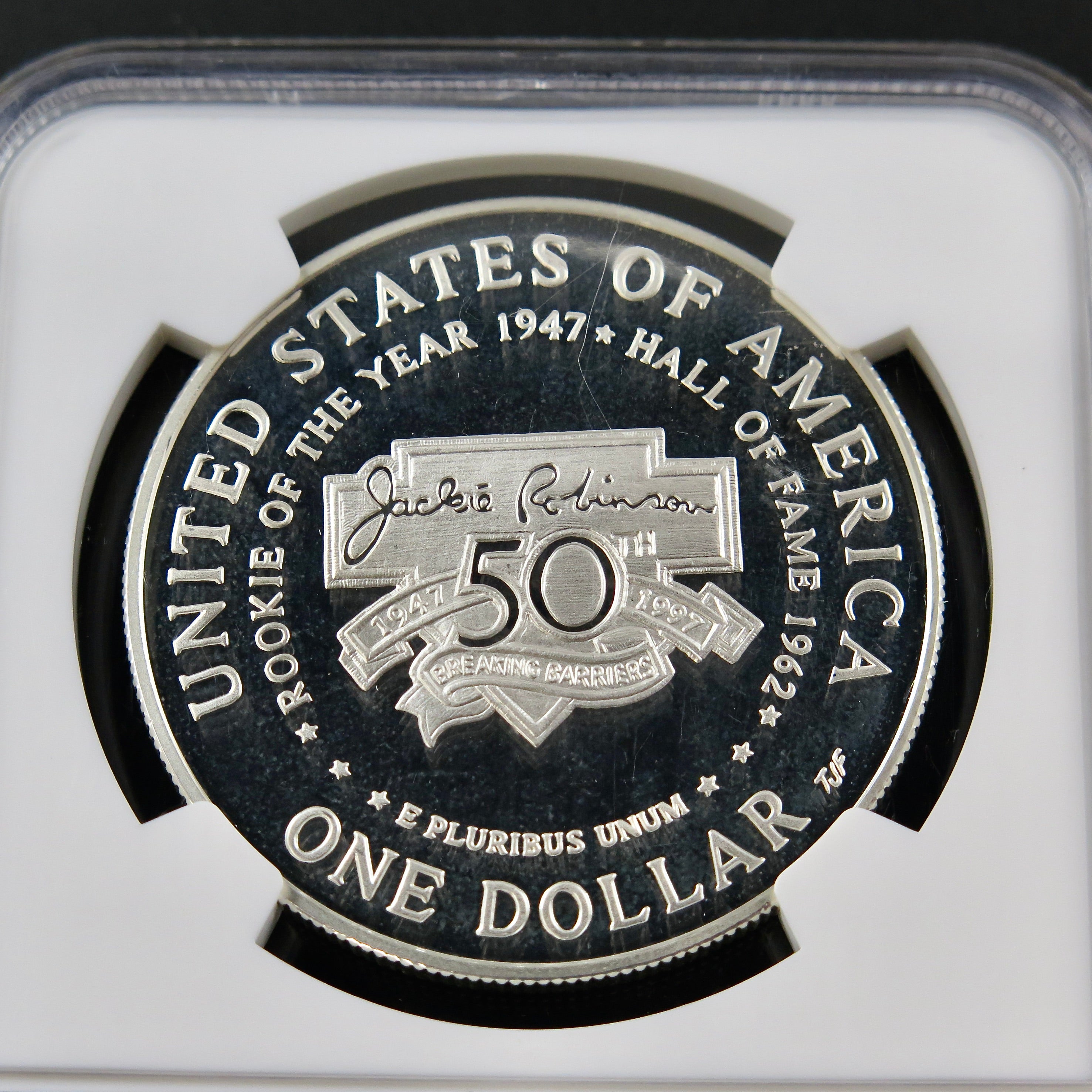 Silver dollar coin featuring Jackie Robinson, 1997-S commemorative NGC Ultra Cameo PF69 coin from Black Market LLC.