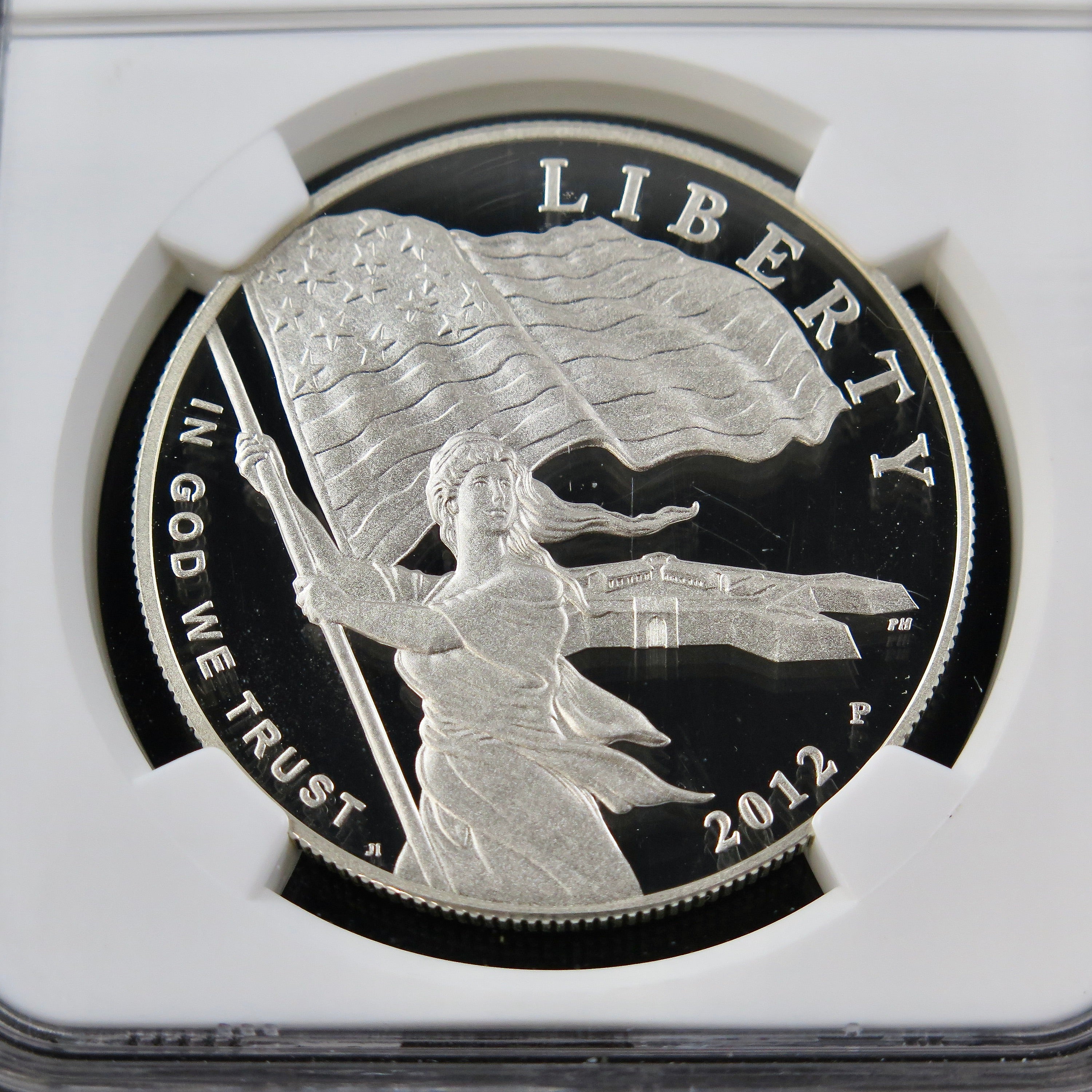 Close-up of the 2012 Star Spangled Banner Dollar commemorative coin, graded PF70 NGC ER, showcasing intricate patriotic design.
