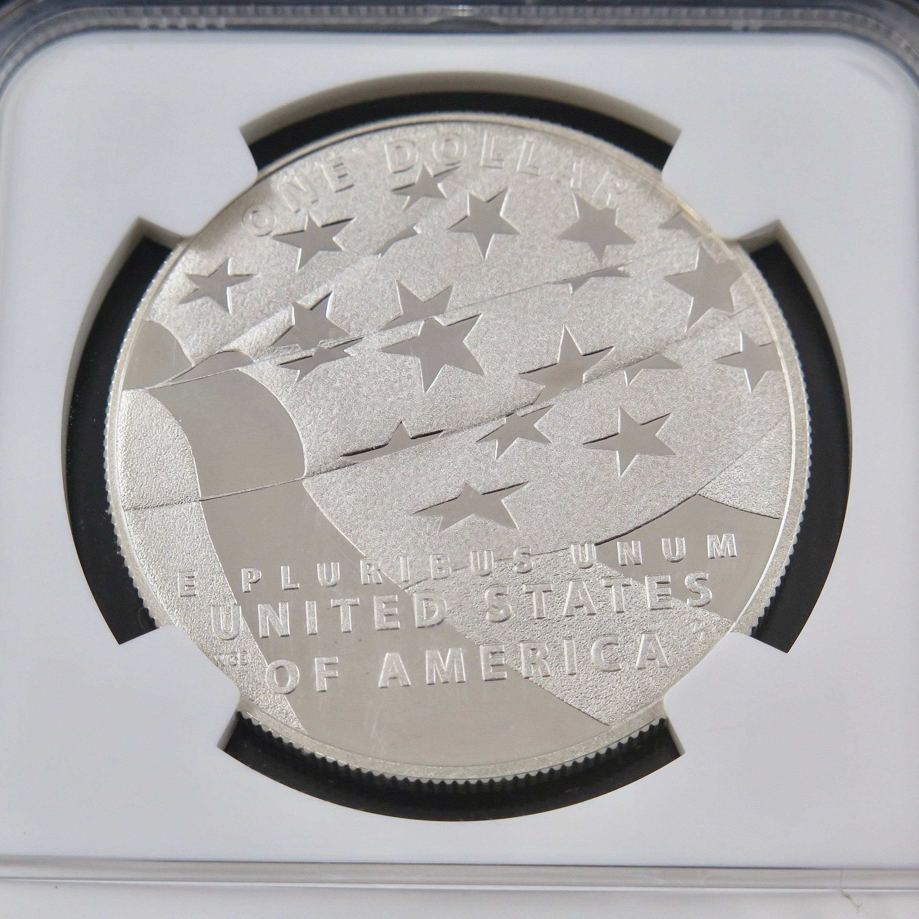 Close-up of the 2012-P Star Spangled Banner Dollar commemorative coin in PF70 NGC ER holder, showcasing detailed patriotic design.