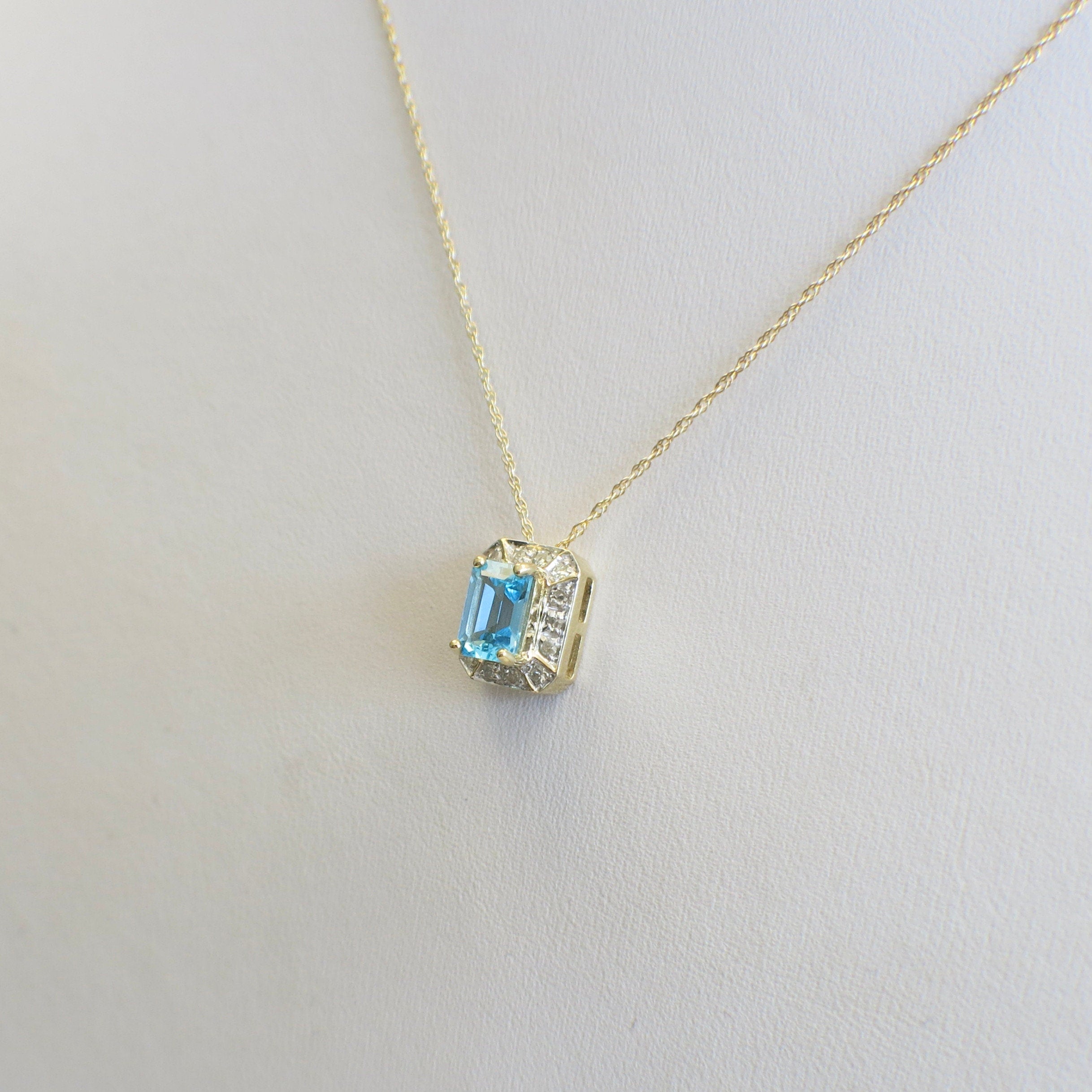 10K Gold Swiss Blue Topaz Necklace with Diamond Halo – 18" Pendant - Black Market LLC