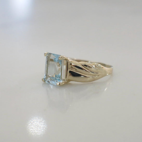 Emerald Cut Sky Blue Topaz Solitaire 10K Yellow Gold Ring
