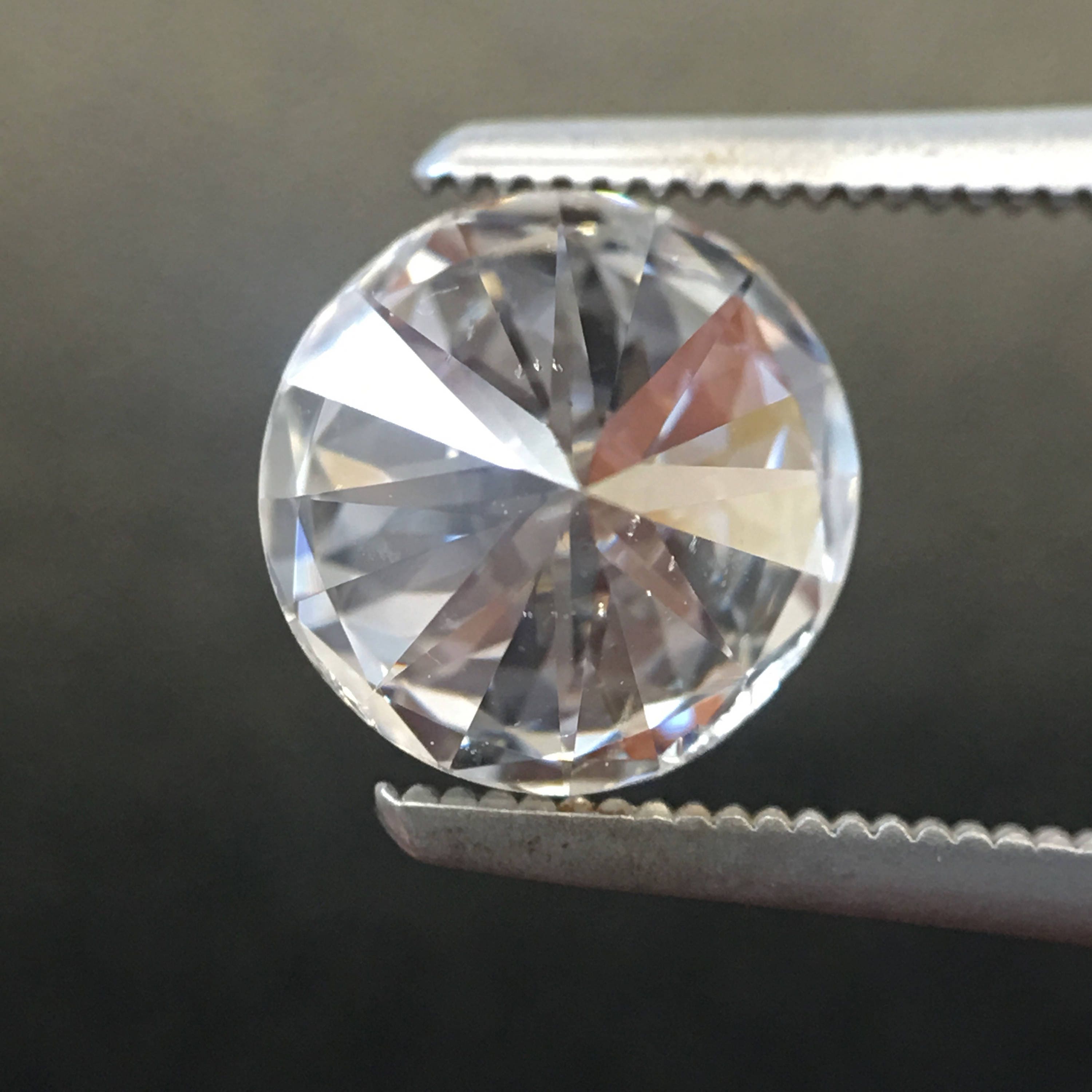 GIA Certified 0.88 CTW round brilliant diamond loose stone with E color and SI1 clarity from Black Market LLC.